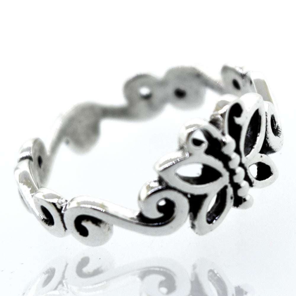 A beautiful butterfly ring with swirl design band.