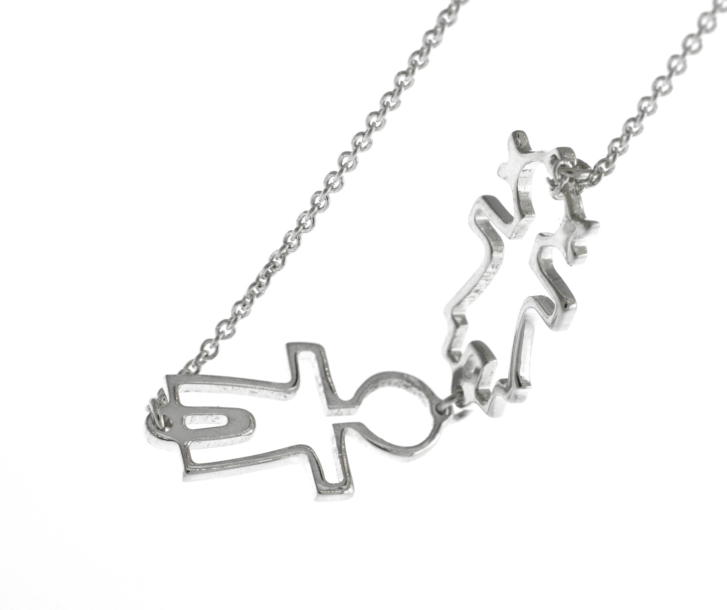 A Super Silver Little Humans Necklace with a couple of love figures on it.