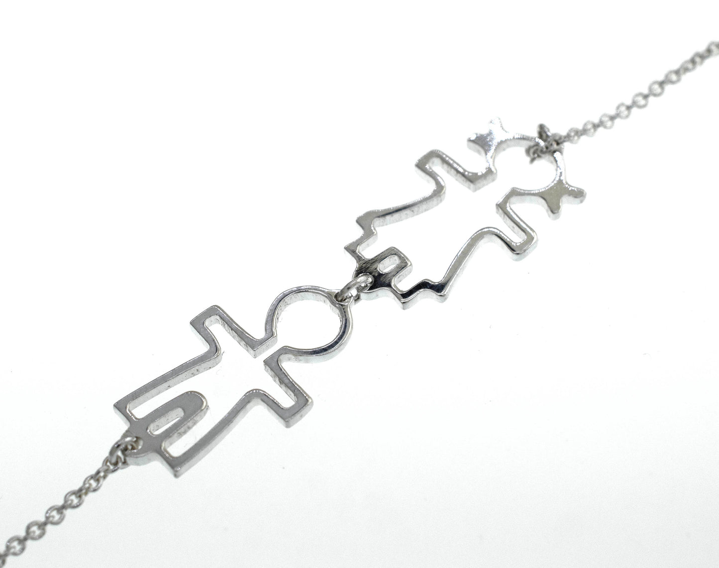 
                  
                    A Little Humans Necklace with two people on it from Super Silver.
                  
                