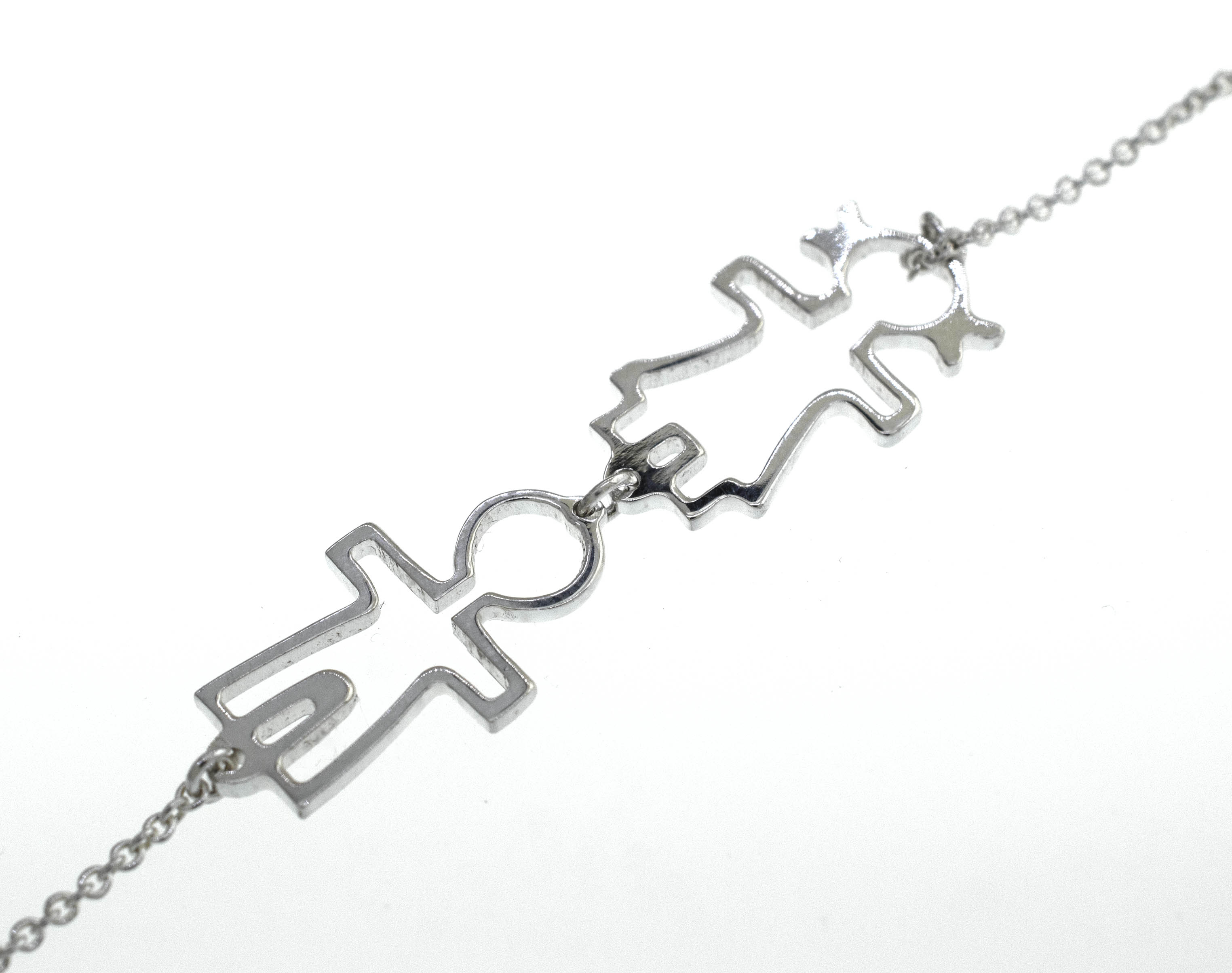 A Little Humans Necklace with two people on it from Super Silver.