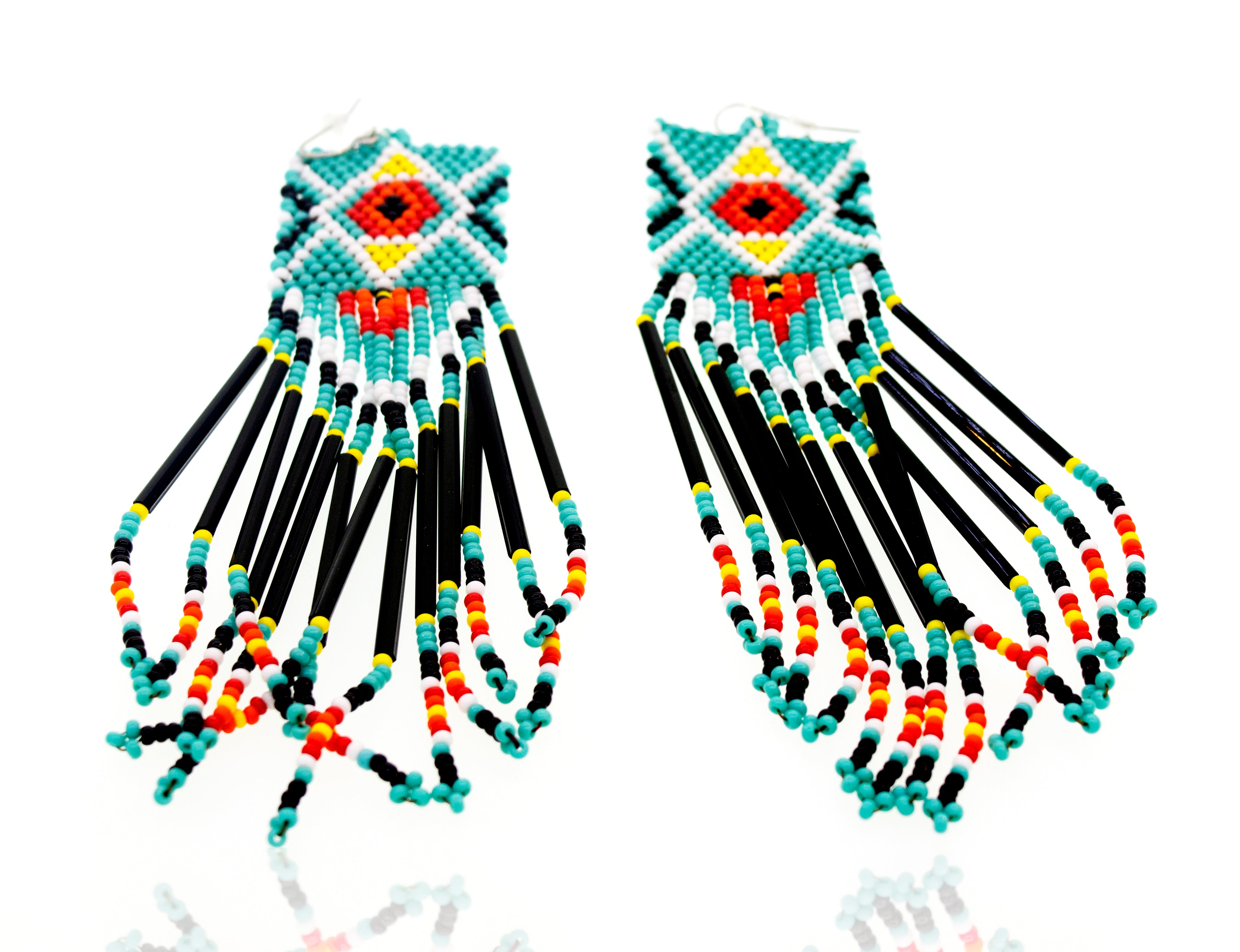 A pair of Super Silver handmade Southwest inspired style earrings with gemstone beads.