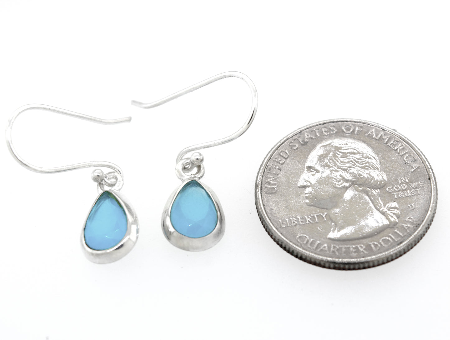A pair of Simple Teardrop Shape Blue Chalcedony Earrings by Super Silver with a blue opal stone in a sterling silver setting.