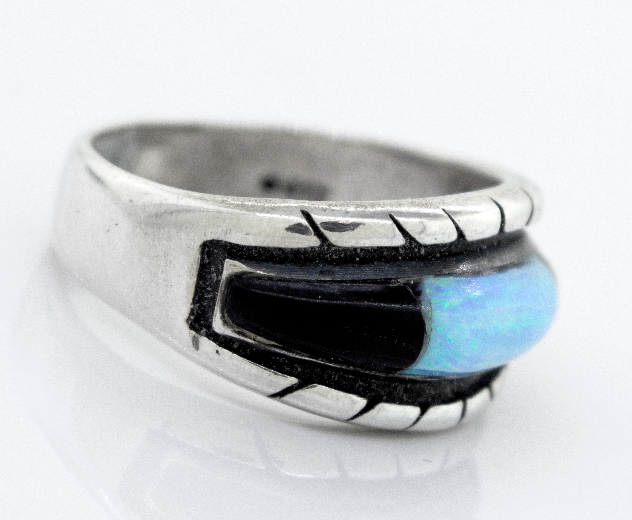 A Super Silver American Made Opal Inlay Ring with a blue opal.