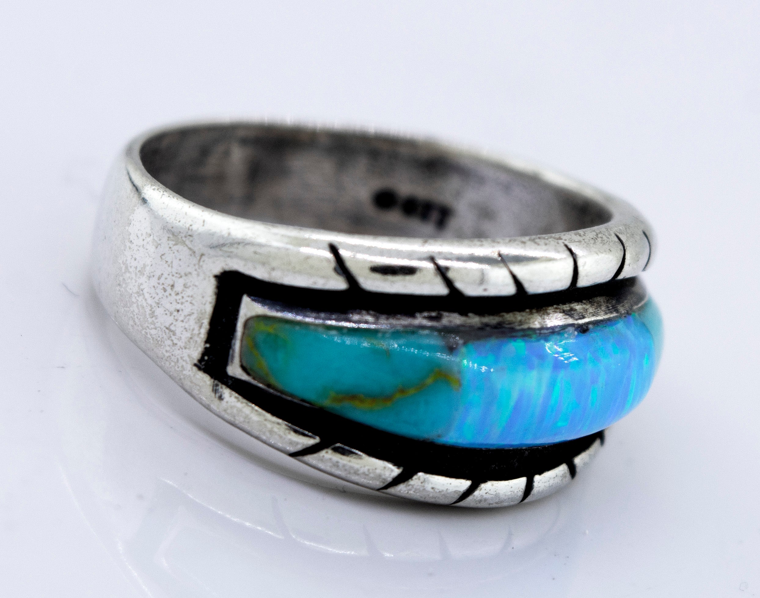 A Super Silver American Made Opal Inlay Ring with a turquoise stone.