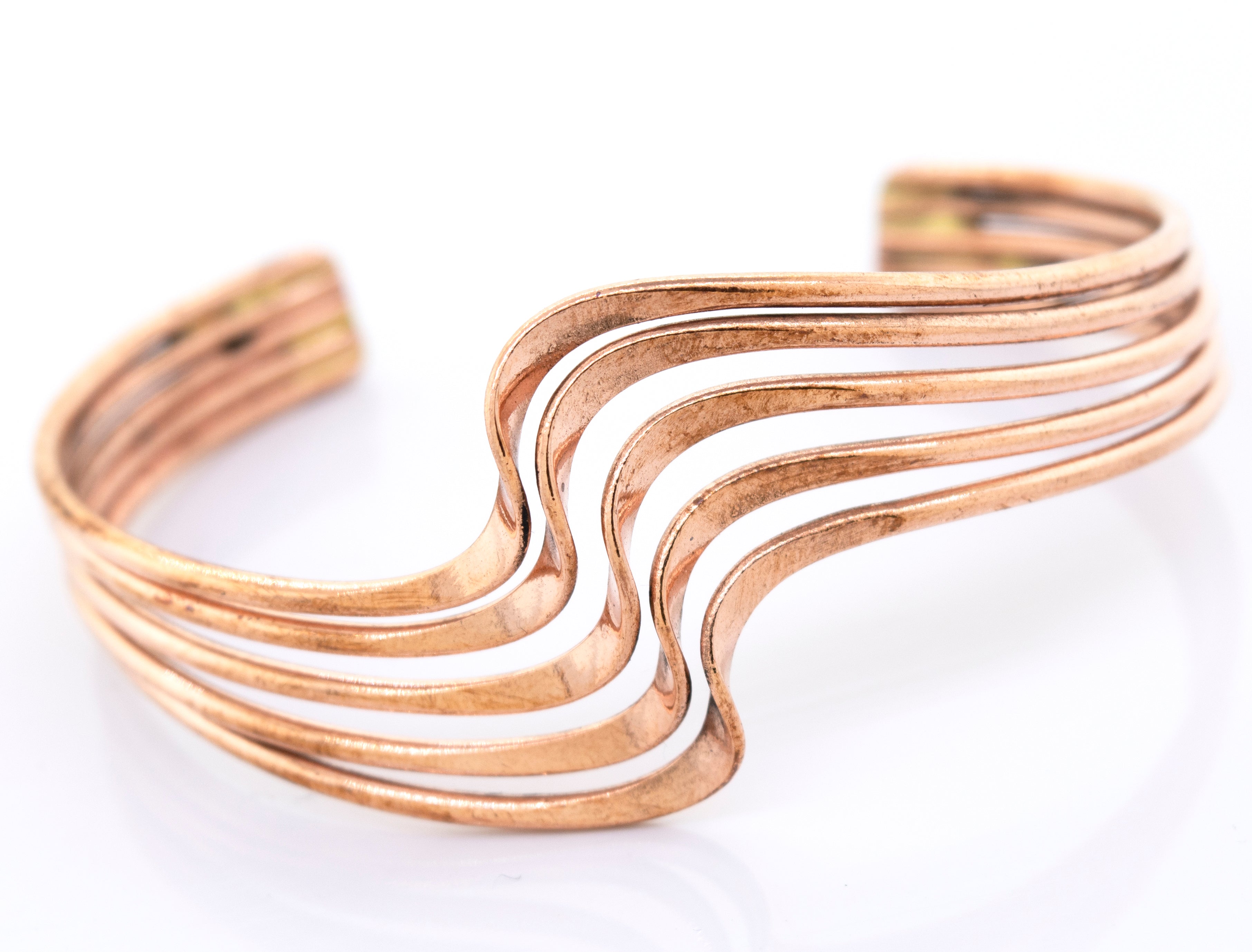A Super Silver wavy copper bracelet.