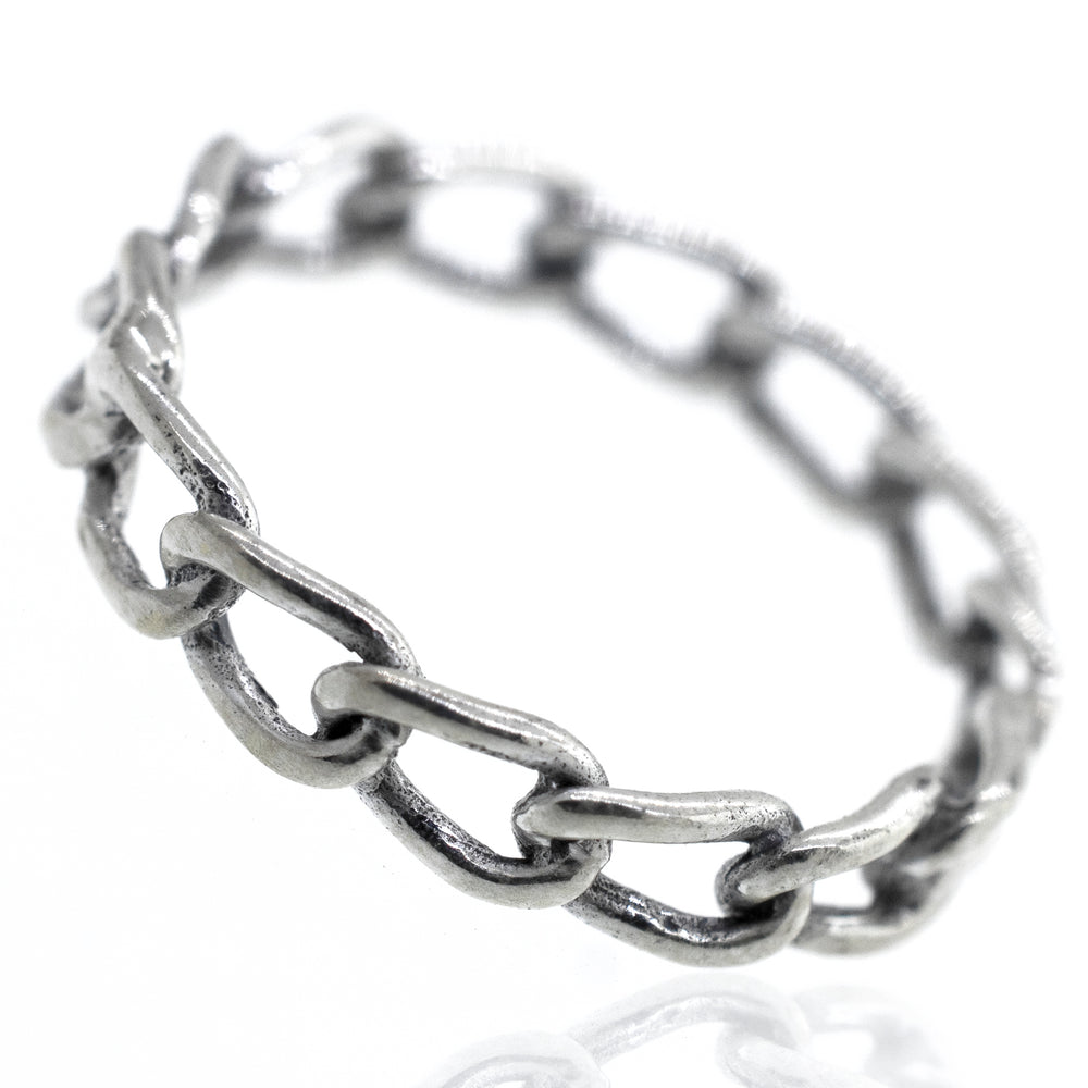 A Super Silver Chain Link Wire Ring on a white surface.
