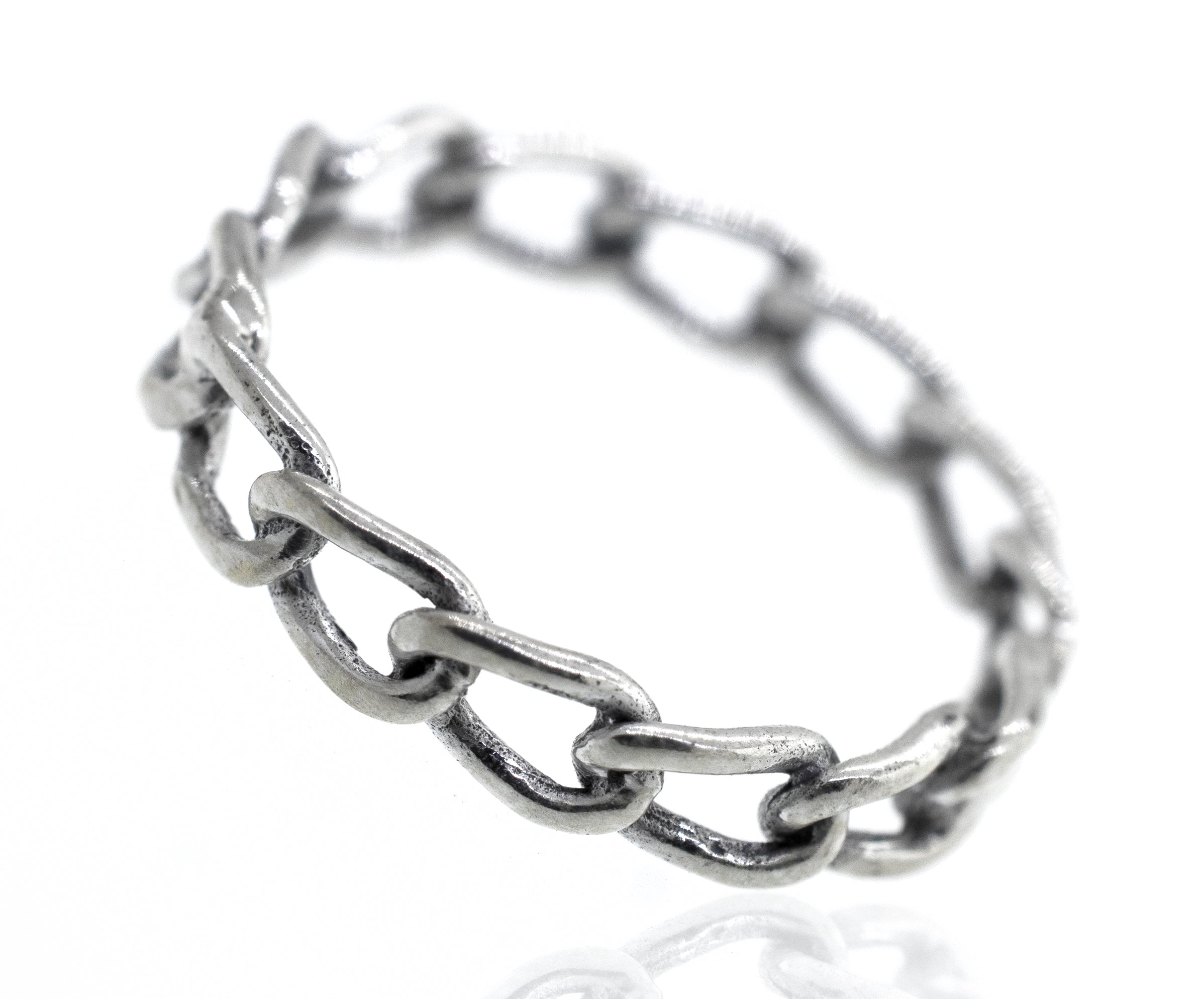 A Super Silver Chain Link Wire Ring on a white surface.
