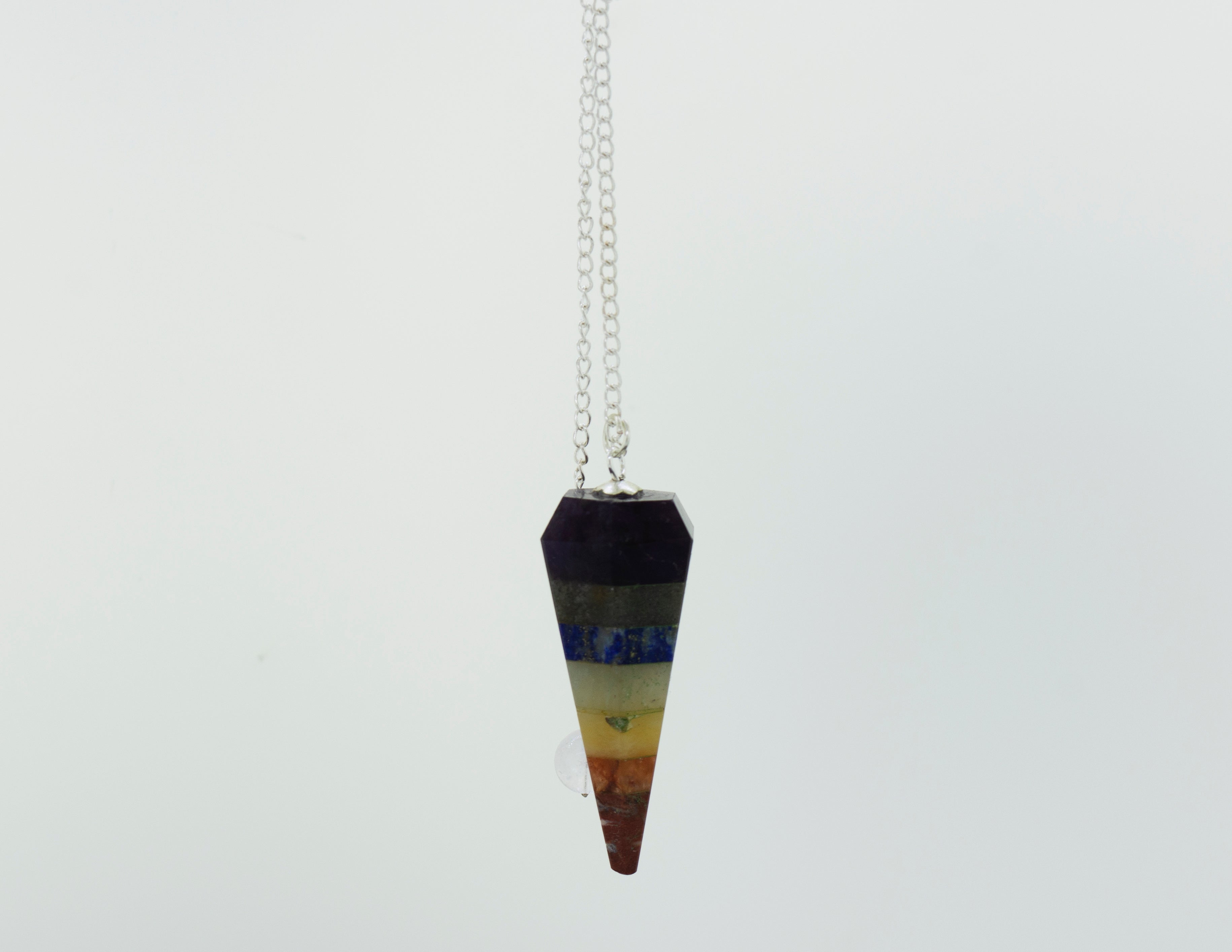 A colorful necklace with a Chakra Stones Pendulum hanging gracefully from a chain.
