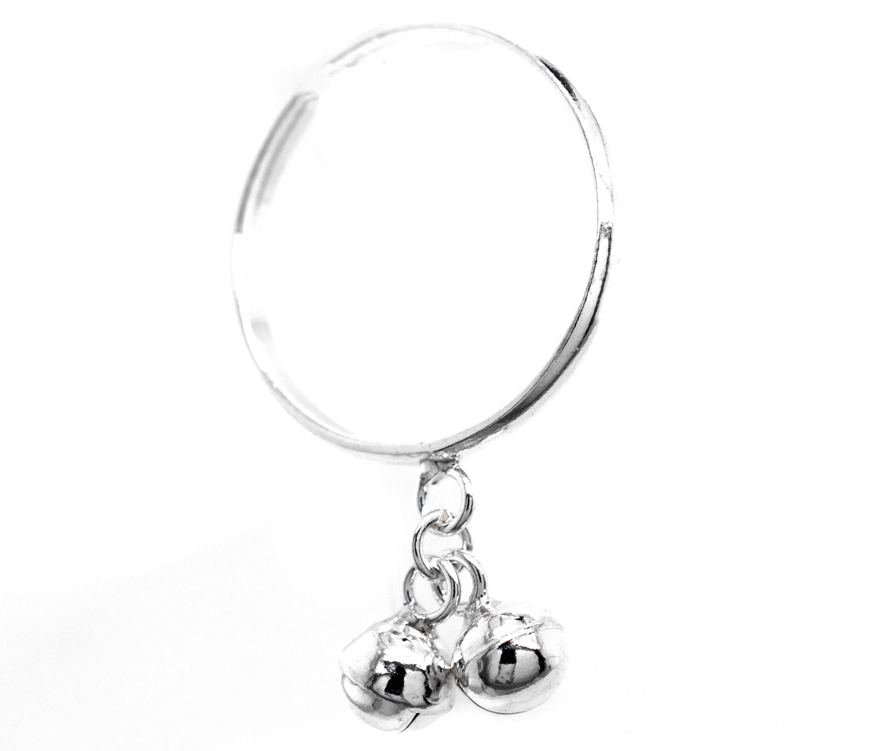 A Delicate Charm Ring with Bells featuring a silver hoop with two silver balls hanging from it by Super Silver.