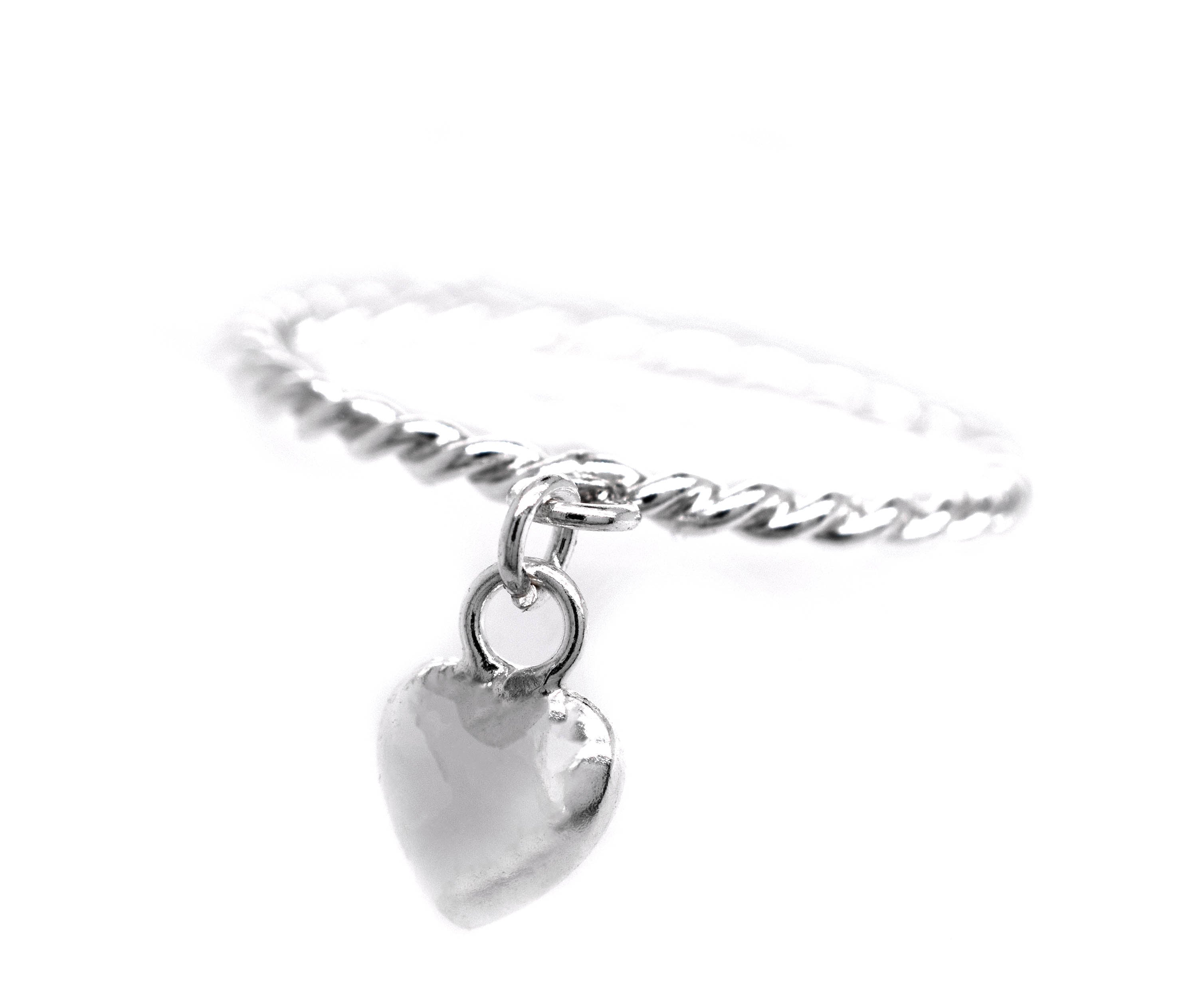 A minimalist design Super Silver Heart Charm Ring With Rope Band that is perfect for stacking.