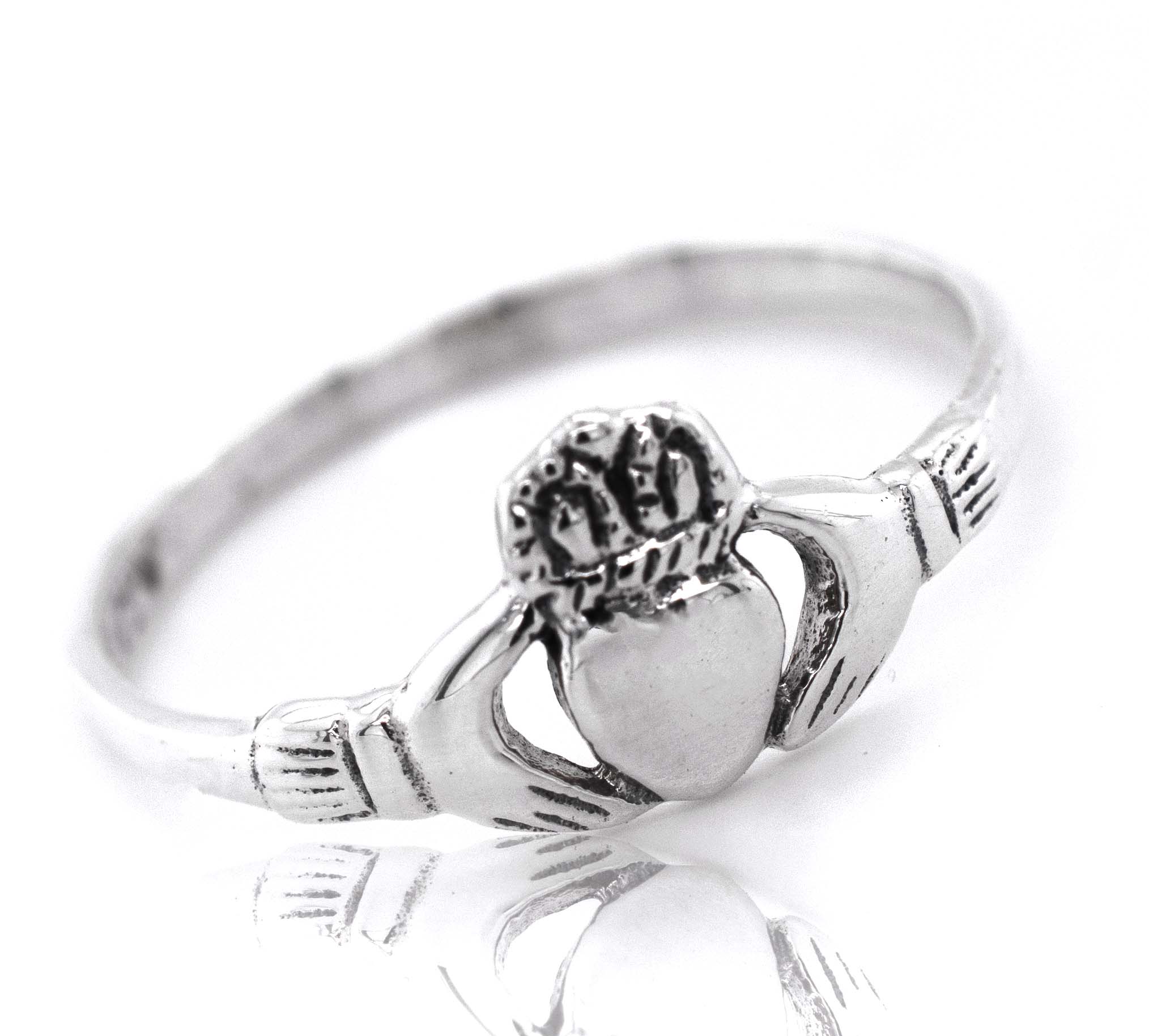 A Claddagh Ring with a heart on it, symbolizing love.
