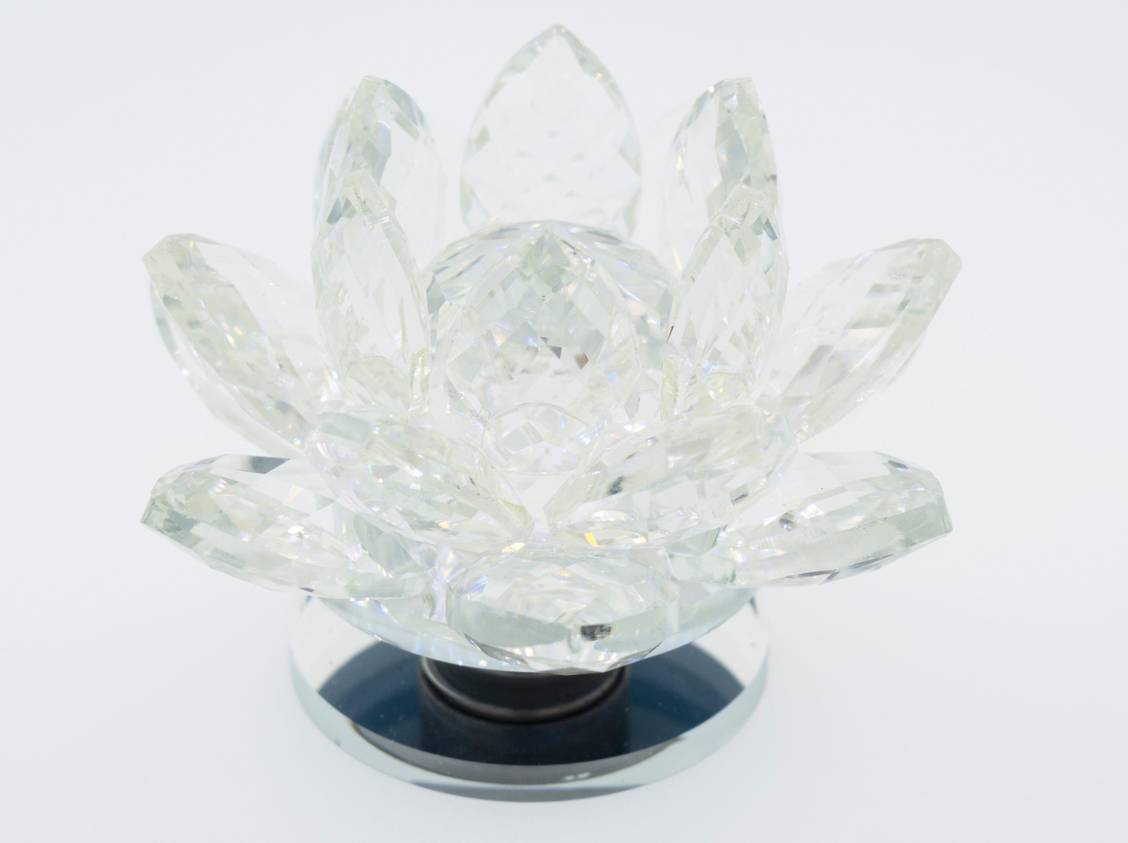 A Crystal Lotus Stand on a white background, illuminating its mesmerizing beauty.