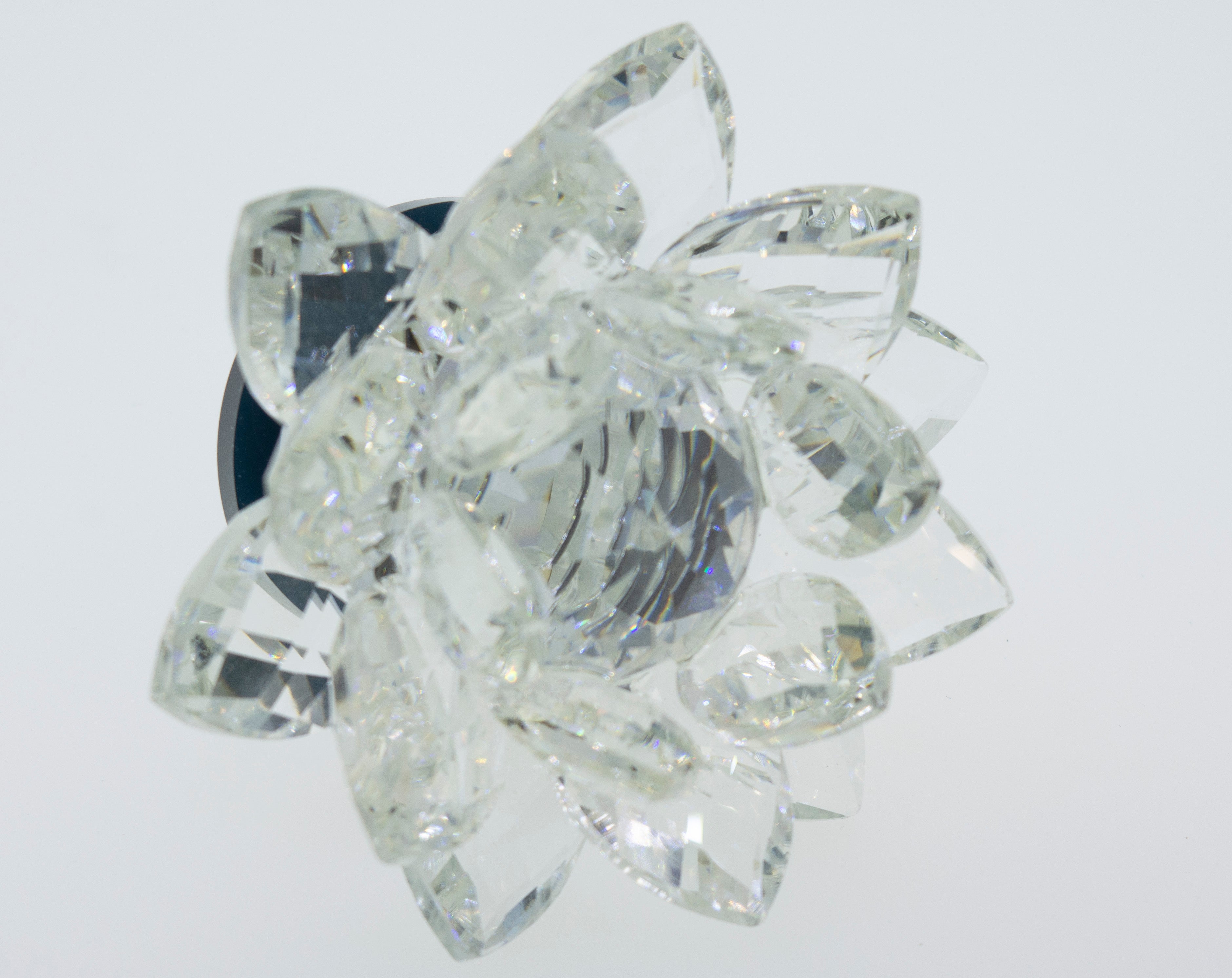 A shimmering Crystal Lotus Stand on a pristine white background.