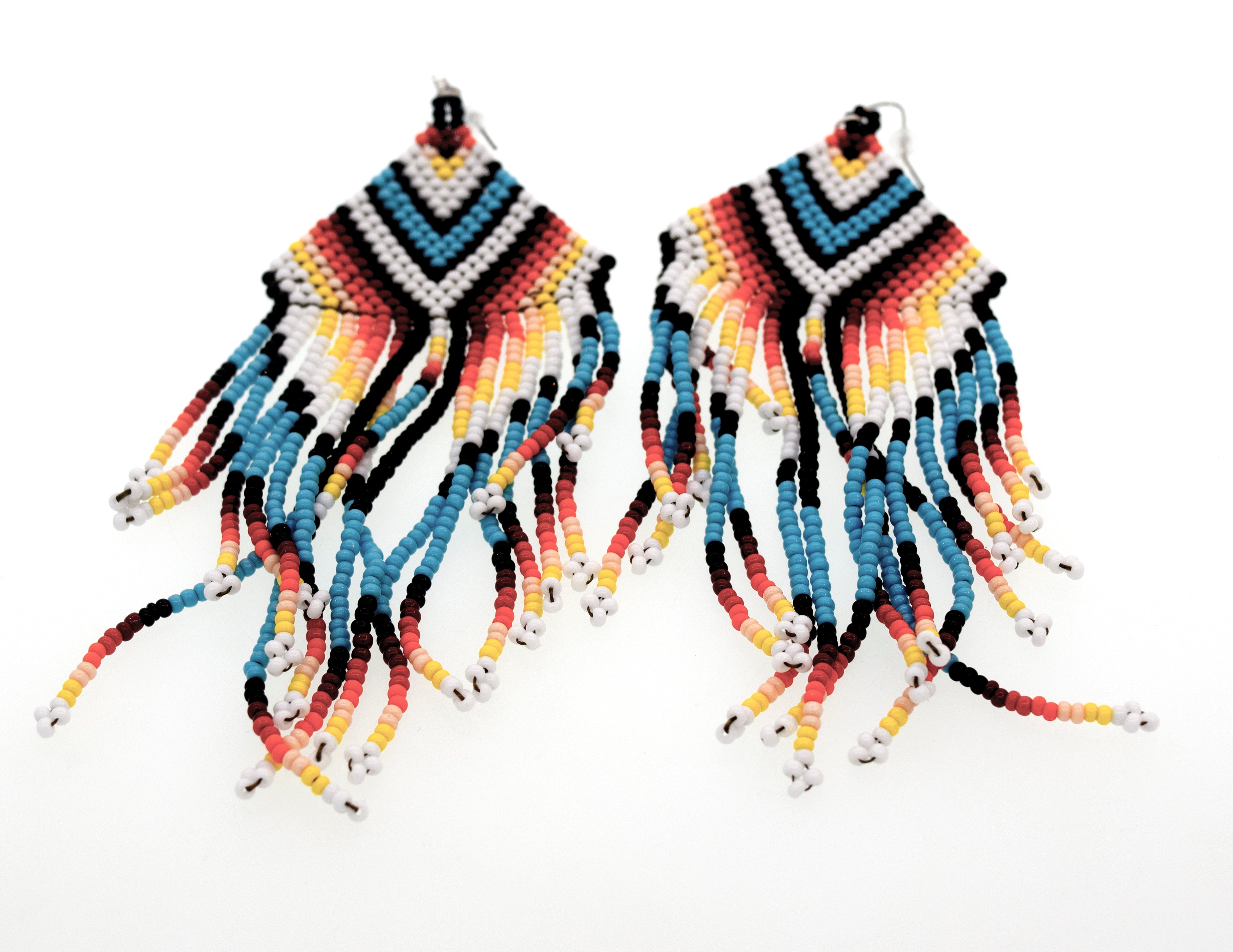 A pair of long and colorful Super Silver Handmade Southwest inspired Earrings with fringes, handmade from surgical steel.