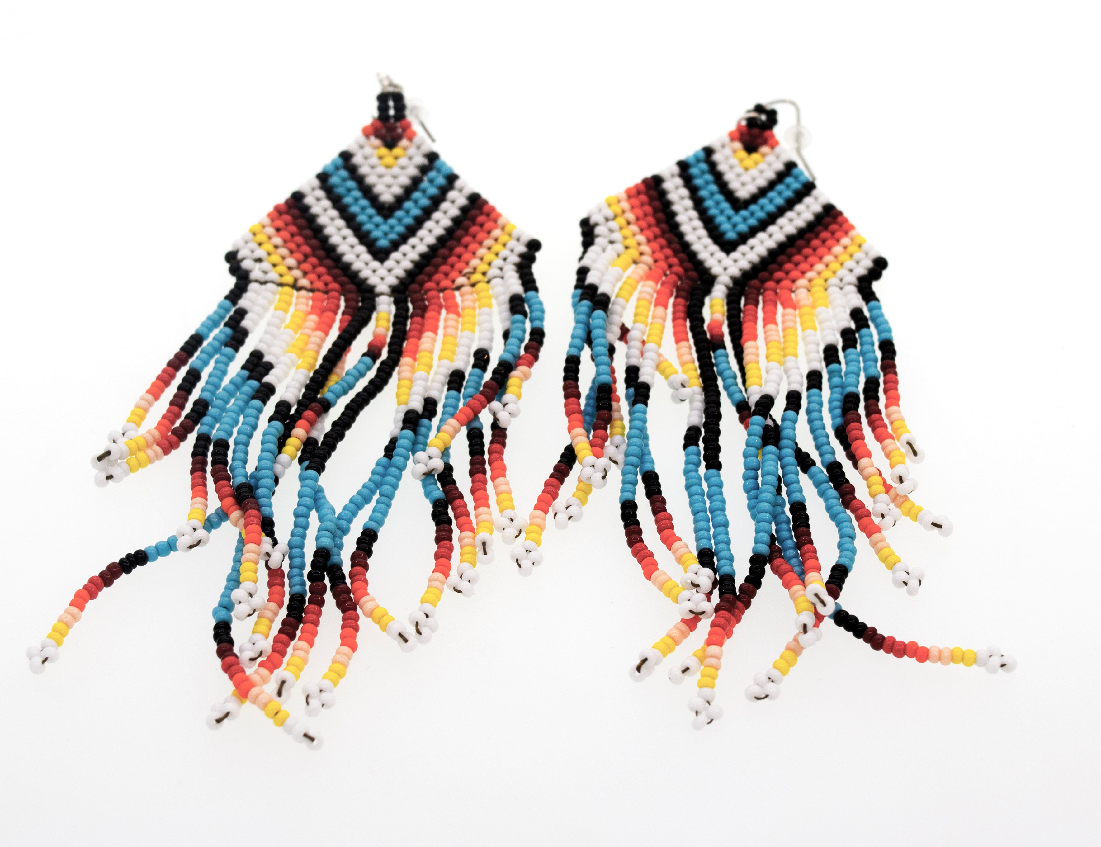 A pair of Handmade Southwest inspired Earrings by Super Silver on a white background.