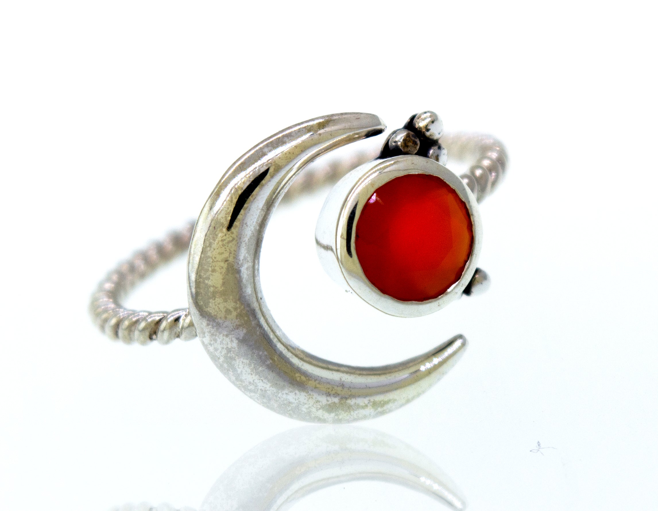 An Online Only Exclusive Adjustable Carnelian Ring with a silver crescent design and an orange carnelian crystal stone.