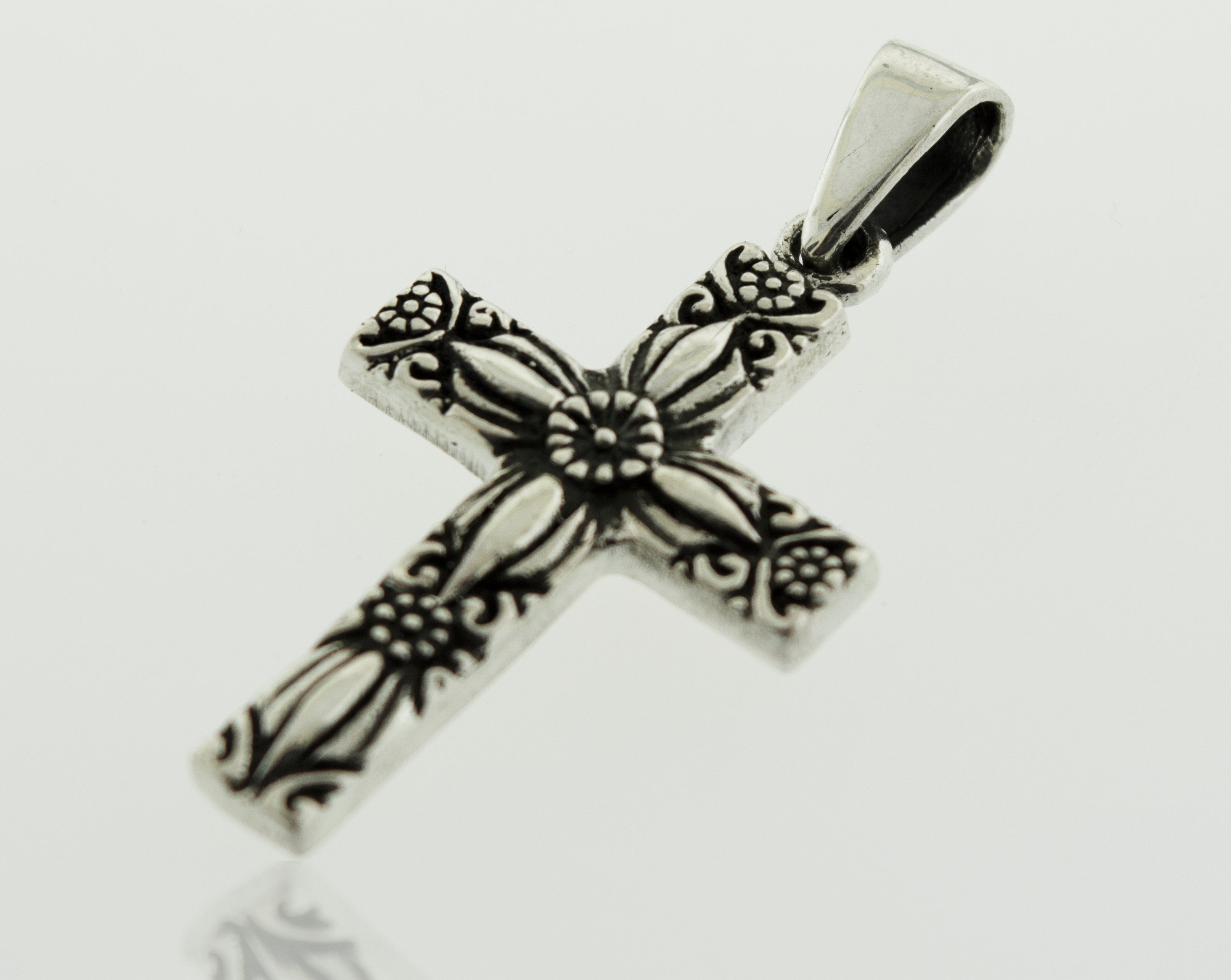 A Super Silver Cross Pendant With Flower Detail featuring a floral design.
