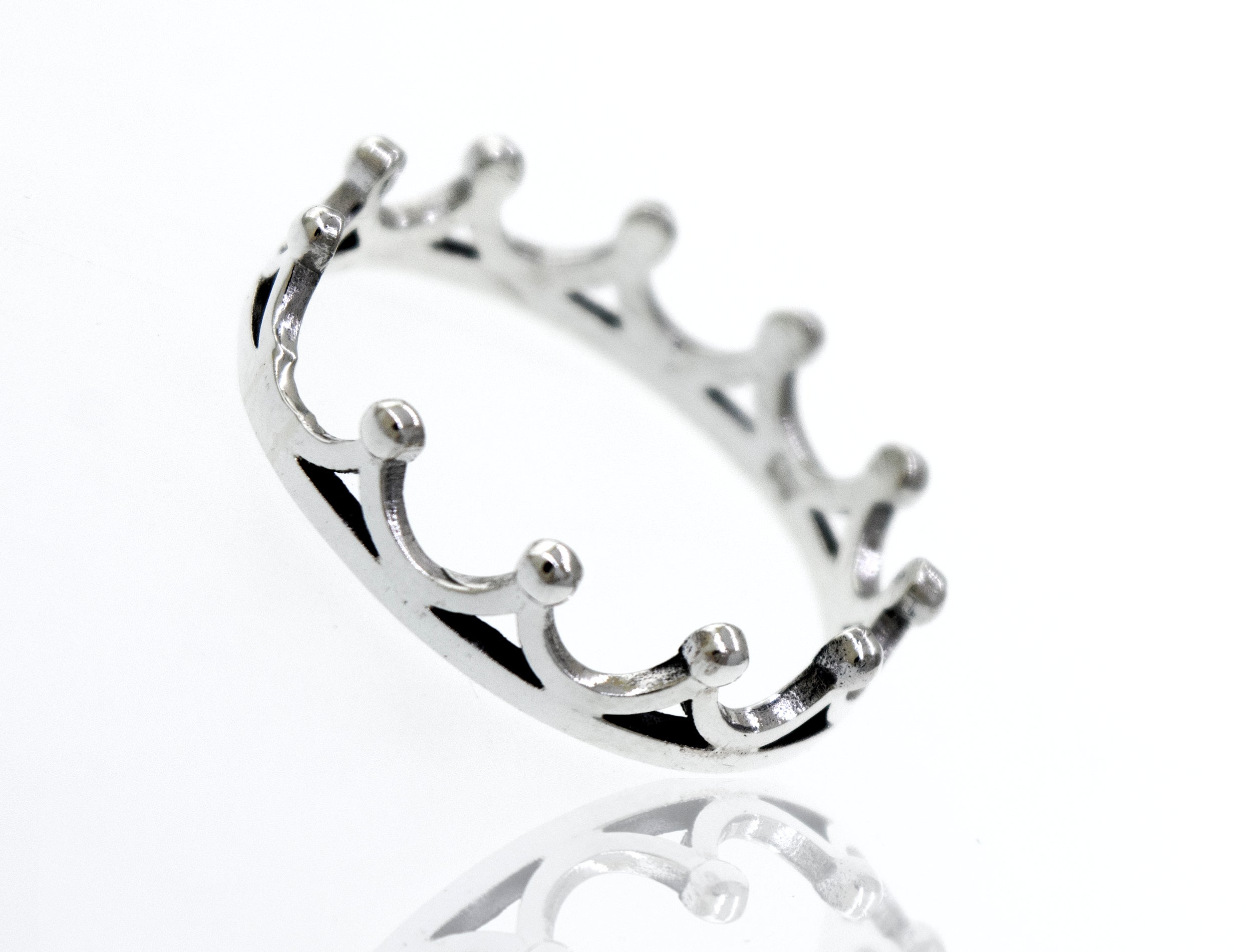 A high polish Super Silver Sterling Silver Crown Ring on a white surface.