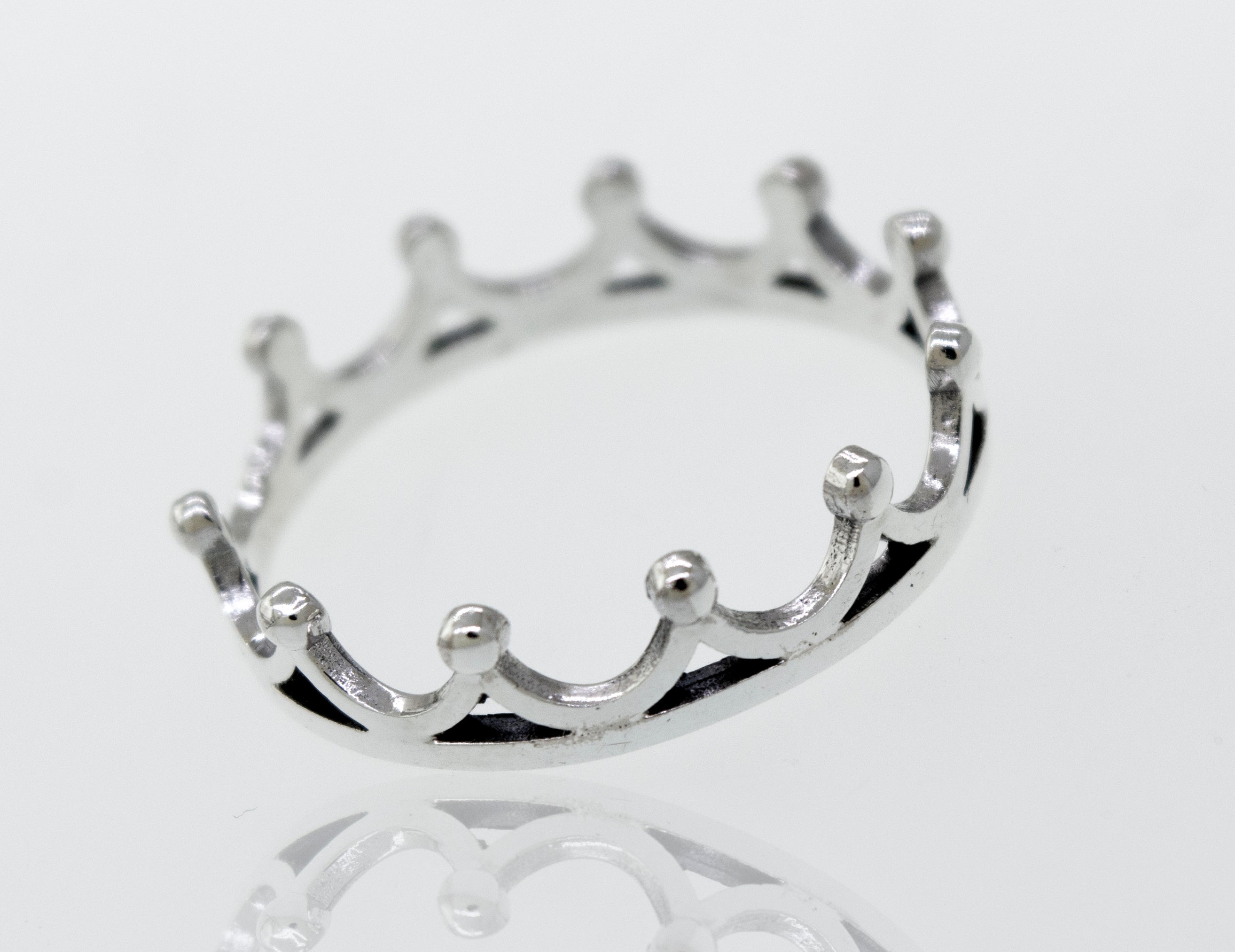 A Super Silver Sterling Silver Crown Ring with a high polish, displayed on a white surface.