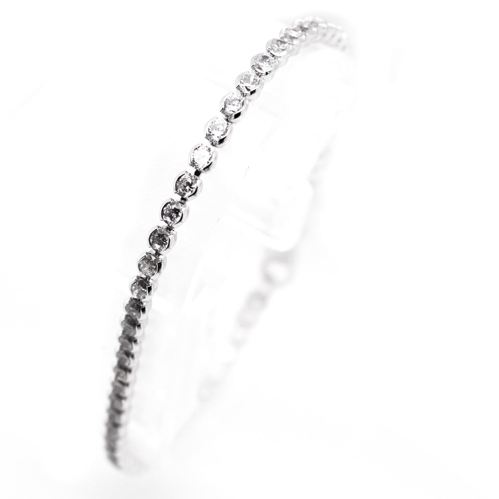 An elegant Super Silver Round Cubic Zirconia Tennis Bracelet with dainty diamonds on it.