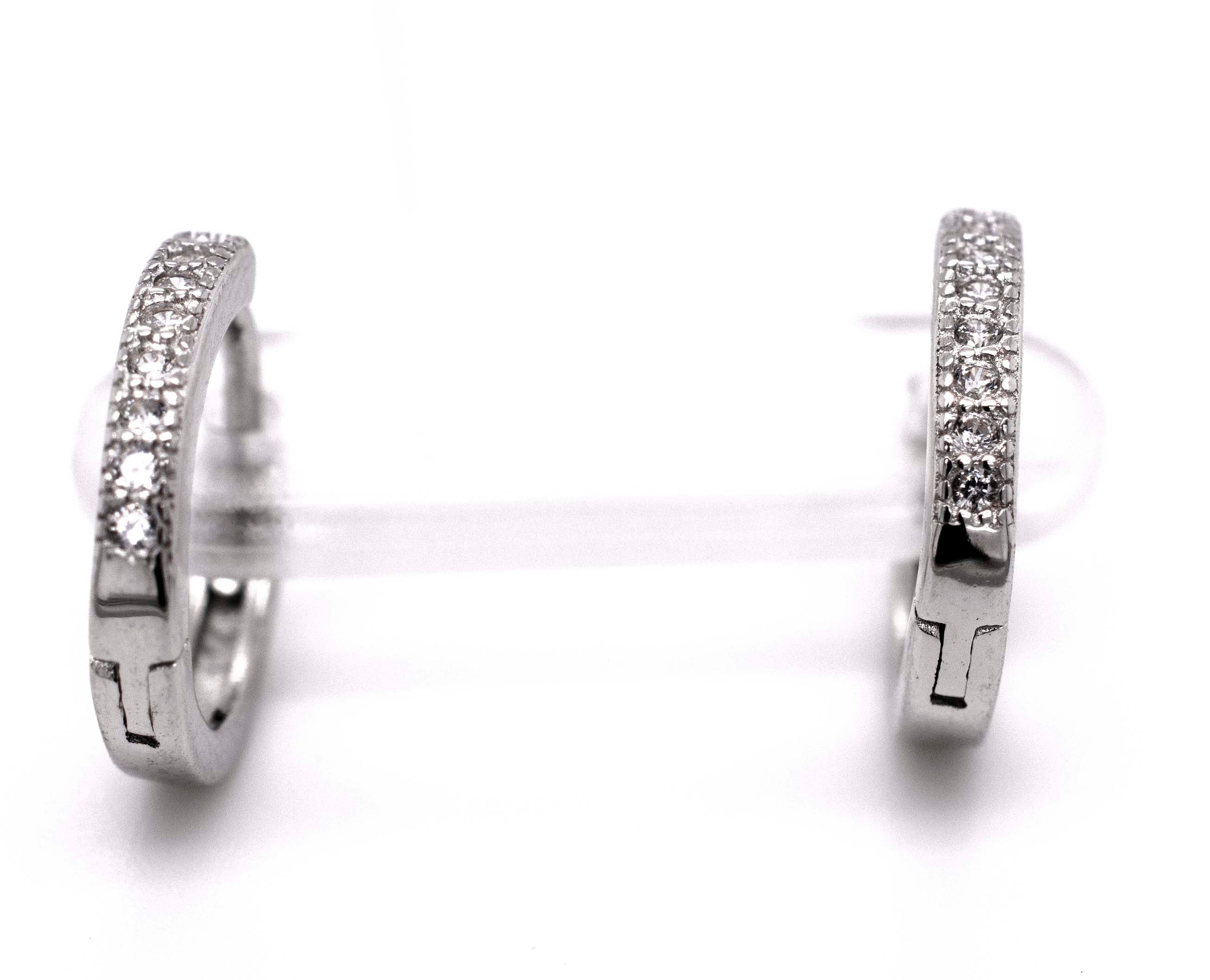 A pair of Small Pave Cubic Zirconia Hoops by Super Silver adorned with sparkling diamonds.