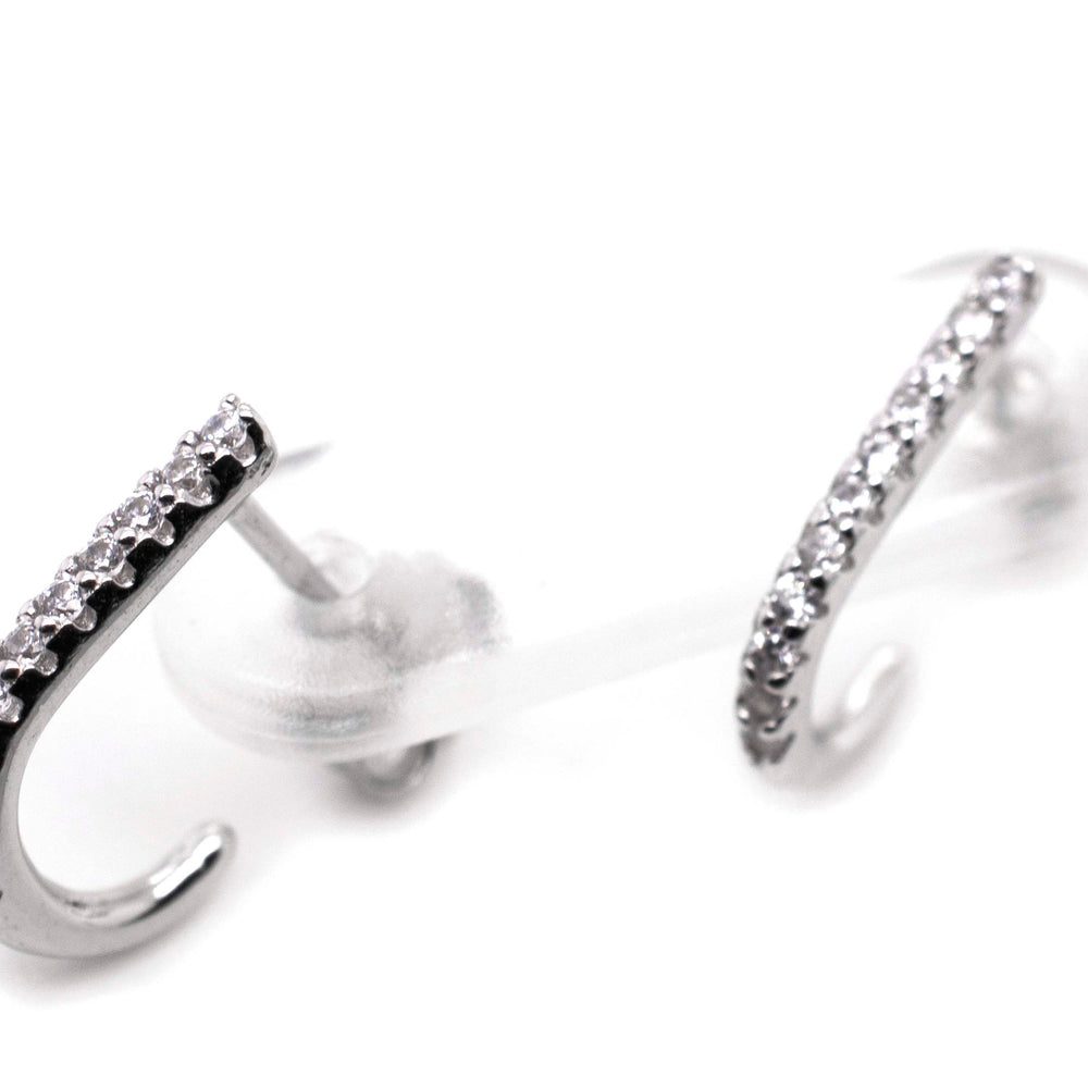 A pair of Super Silver Tiny Pave Cubic Zirconia Half Hoop Post Earrings.