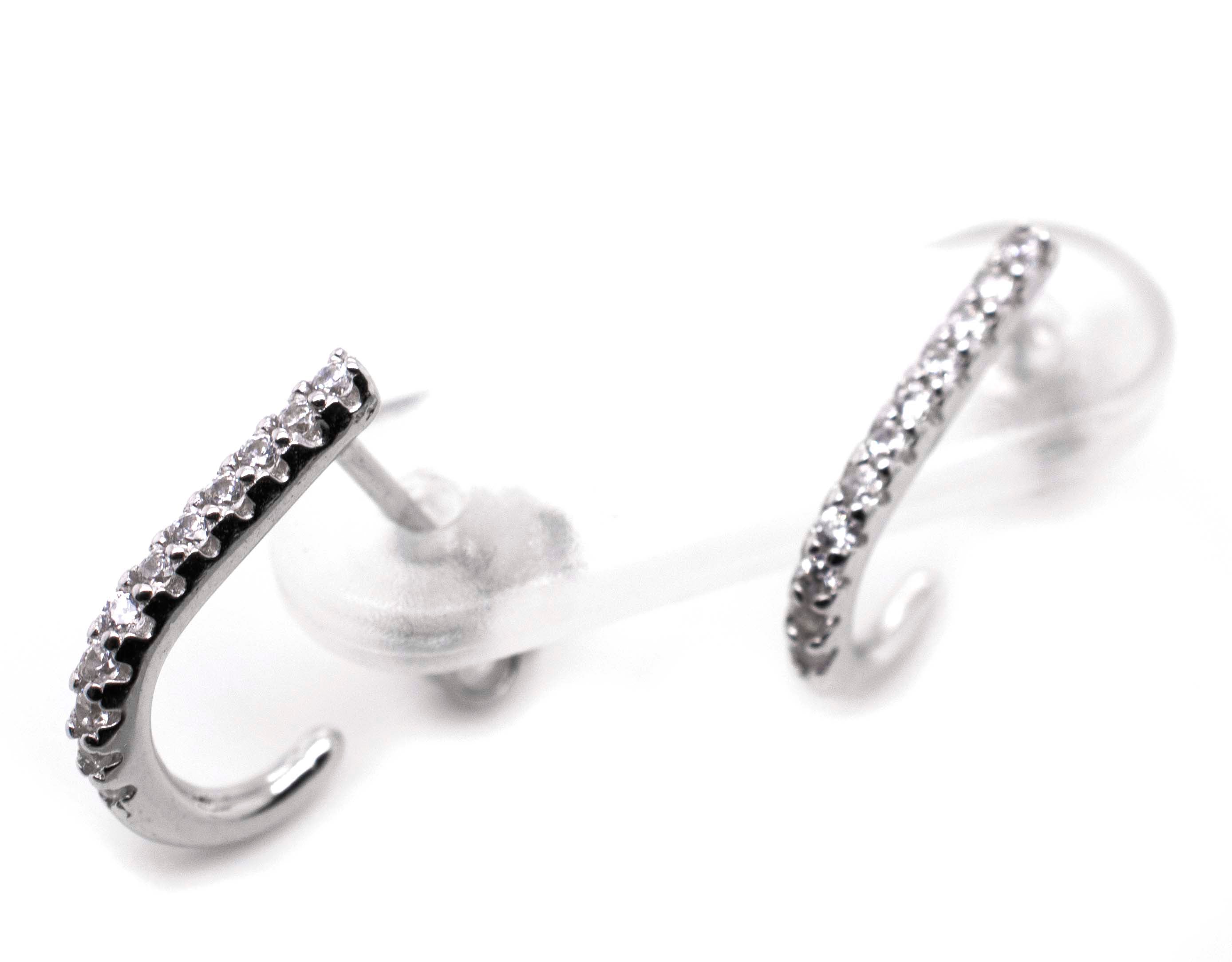 A pair of Super Silver Tiny Pave Cubic Zirconia Half Hoop Post Earrings.