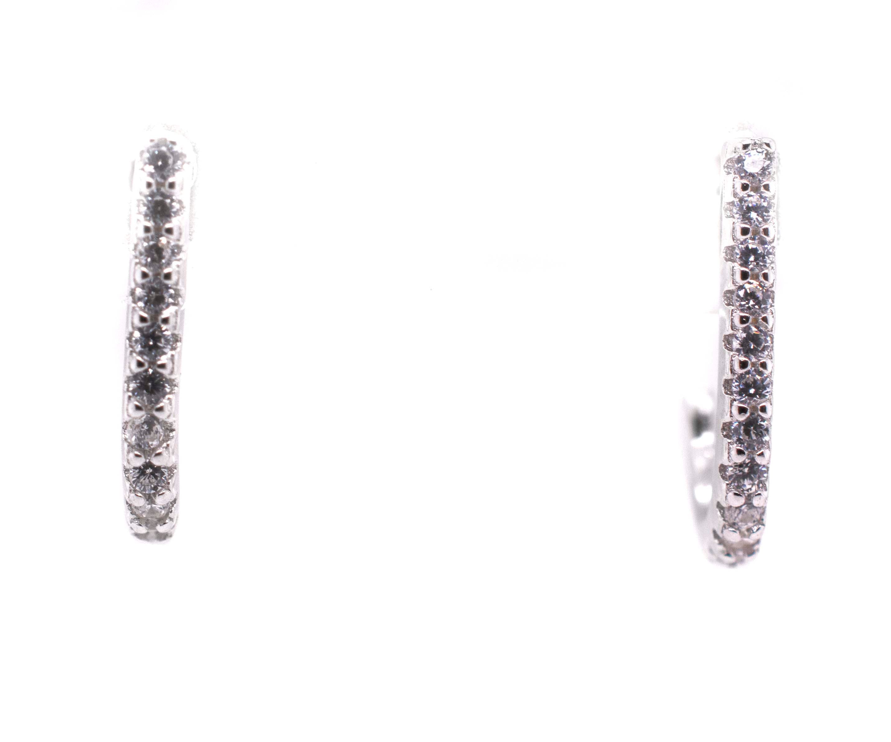 A pair of Super Silver Tiny Pave Cubic Zirconia Half Hoop Post Earrings.