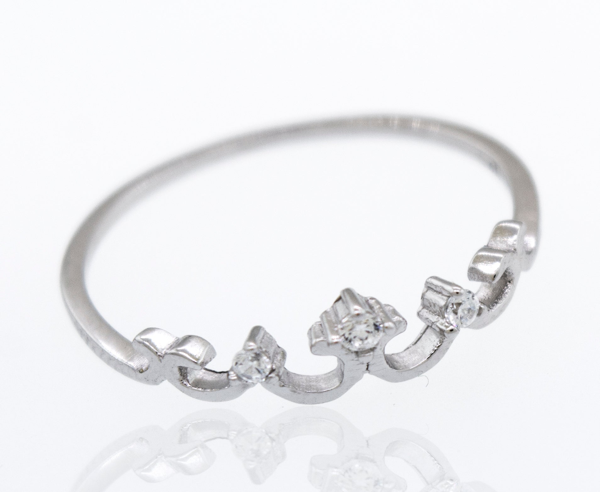 An elegant Crown Ring with Tiny Cubic Zirconia in white gold with diamonds on it.