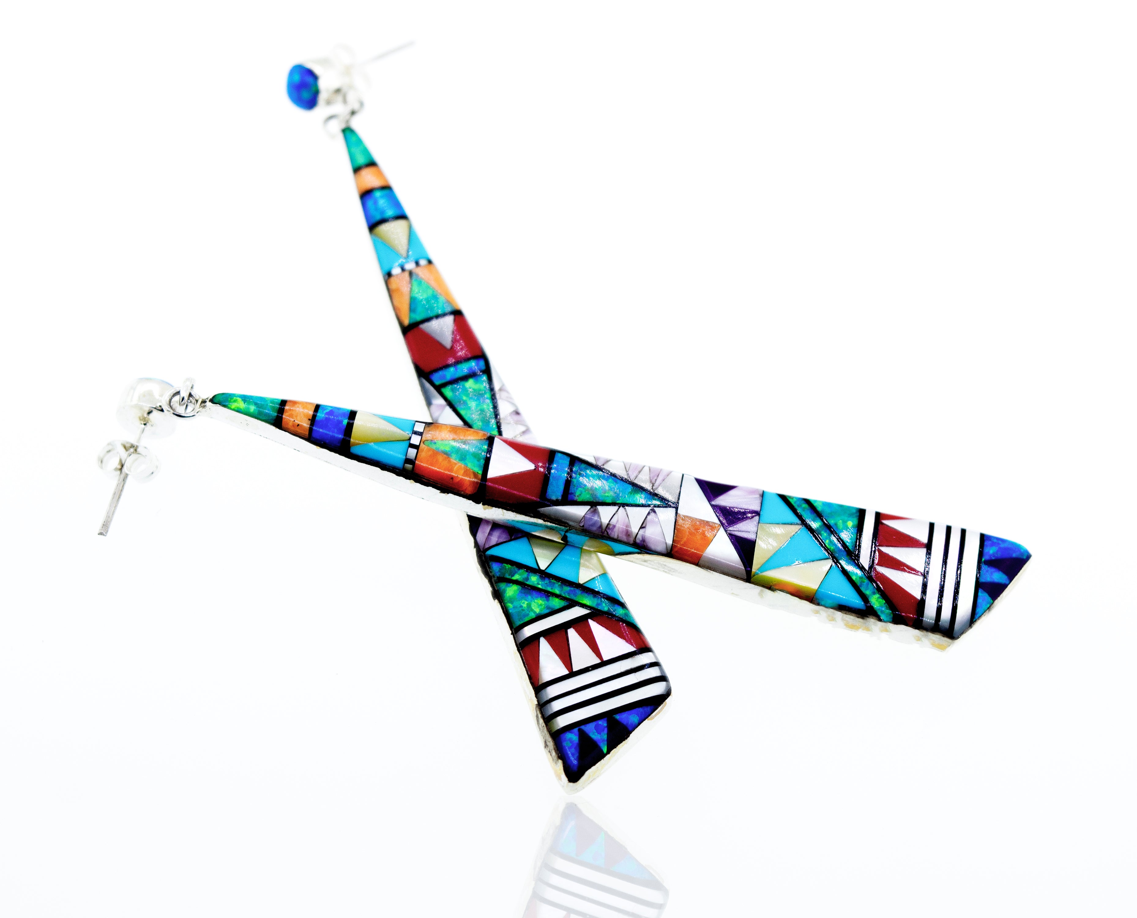 Handcrafted Super Silver Elongated Triangle Earrings with colorful tribal designs.