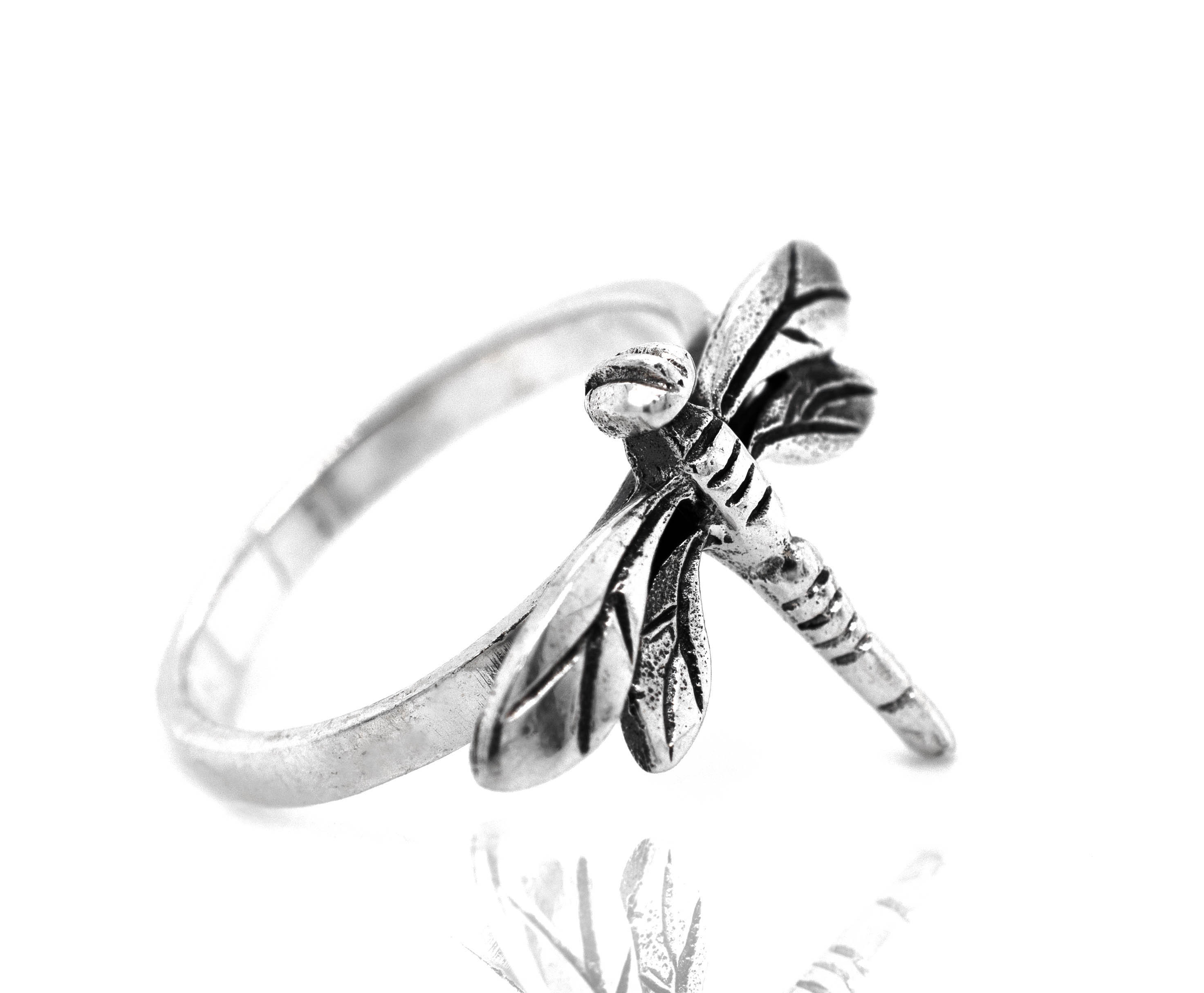 A Brilliant Silver Dragonfly Ring on a white background.