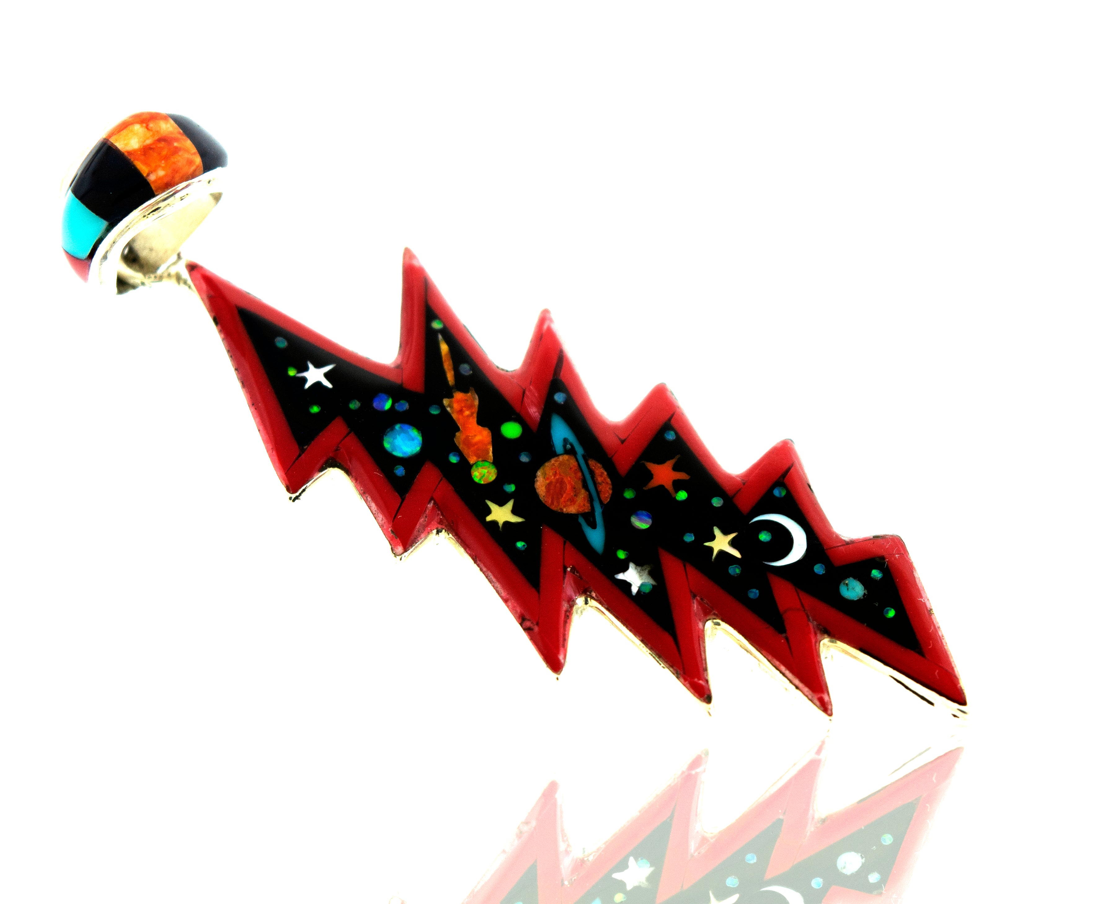 A Beautiful Handmade Super Silver multi-stone pendant featuring a red and blue lightning bolt, adorned with stars and planets, crafted in .925 Silver.