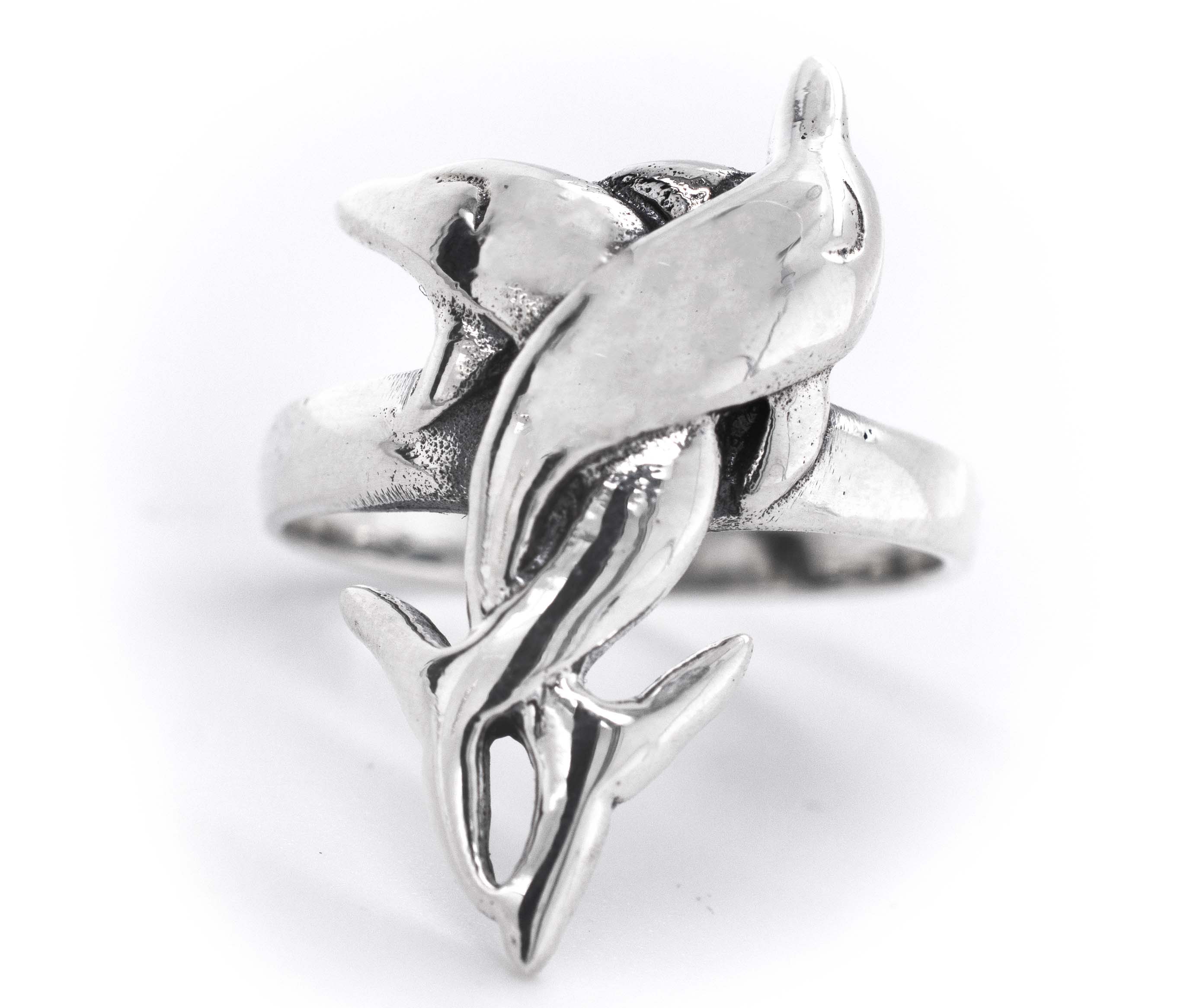 A Coiled Dolphin Ring featuring an intricately crafted dolphin, symbolizing the enchanting ocean.