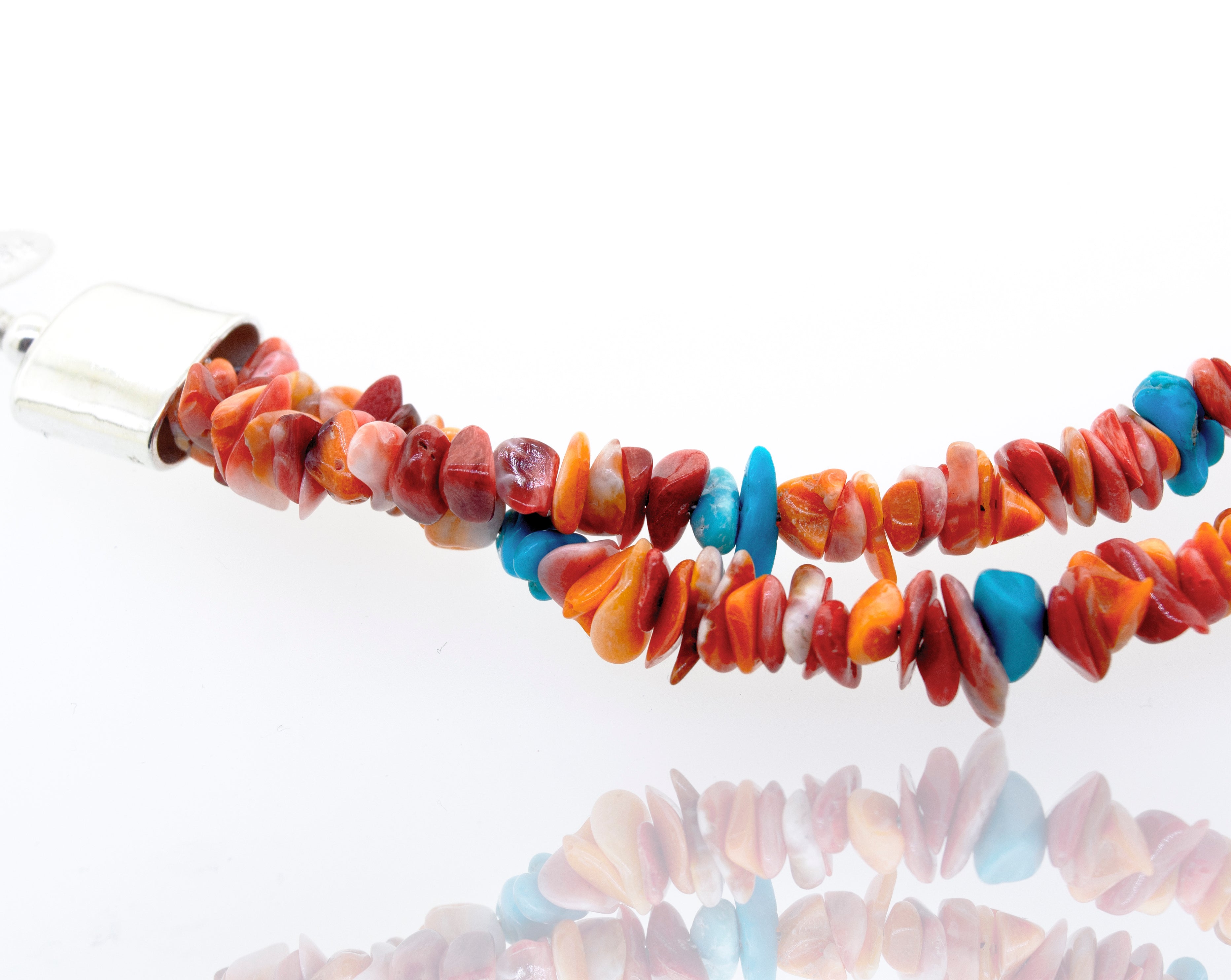 A Handmade Spiny Oyster Shell and Turquoise Necklace by Super Silver with blue beads.