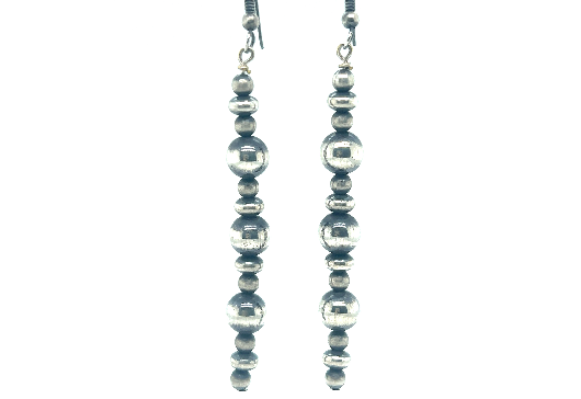 A pair of long handcrafted Navajo pearl earrings with an oxidized finish on a white background by Super Silver.
