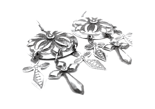 A pair of Super Silver Handcrafted Silver Concho Earrings adorned with delicate flowers and leaves, exuding southwest charm.