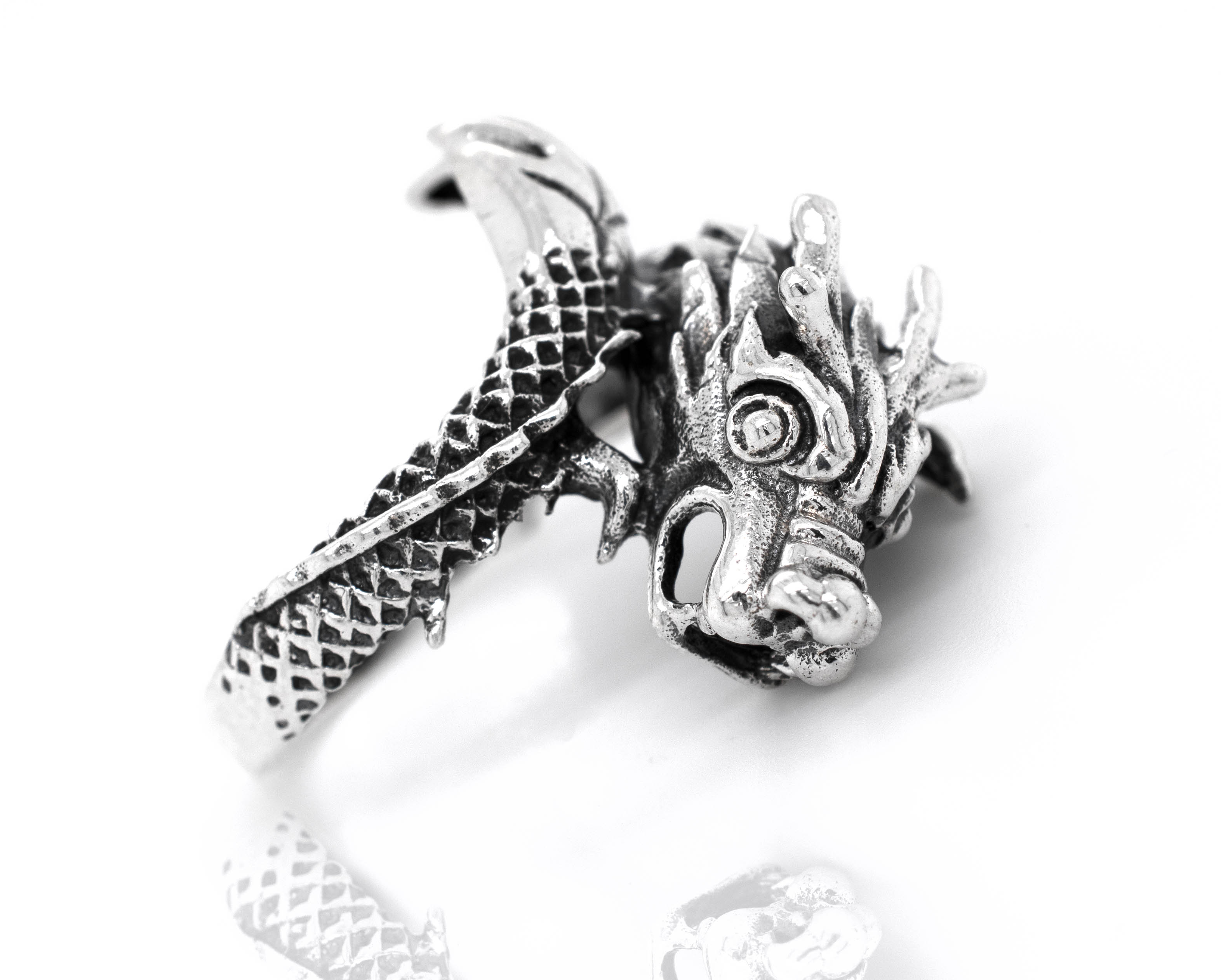 A Striking Silver Dragon Ring with a mythical dragon head design.