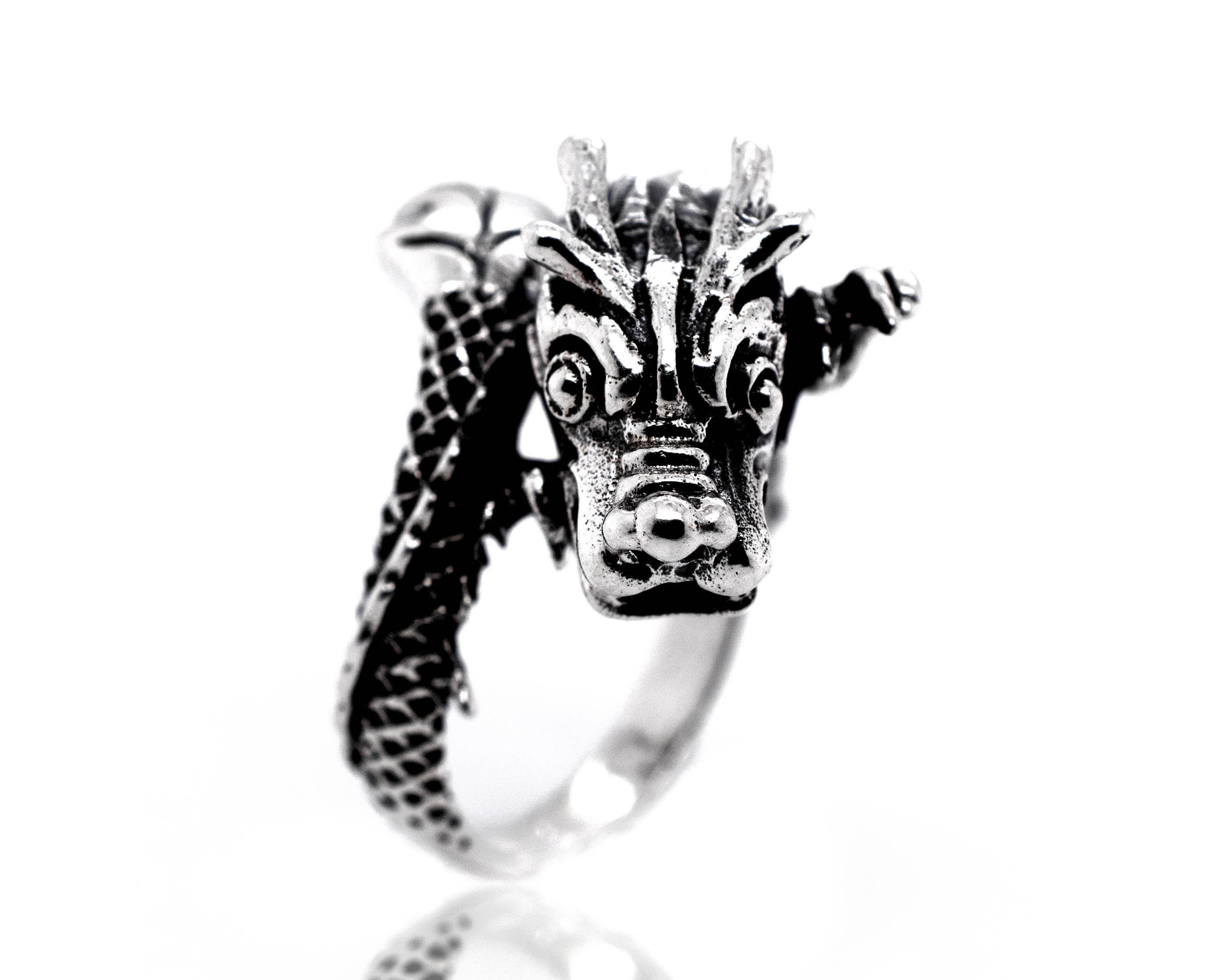 A Striking Silver Dragon Ring with a mythical dragon head.