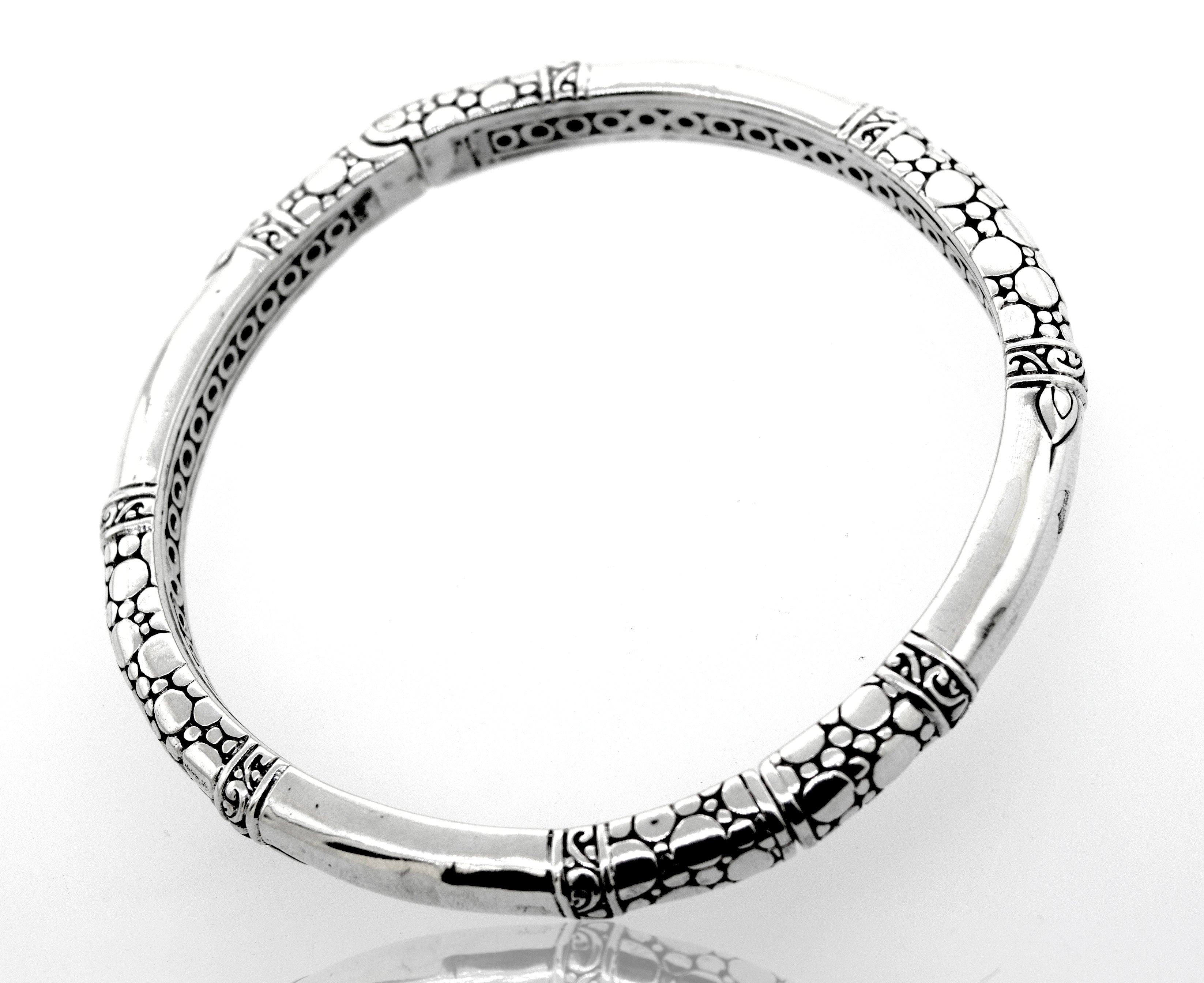A Super Silver Sterling Silver Handmade Designer Bangle with an intricate bubble design.