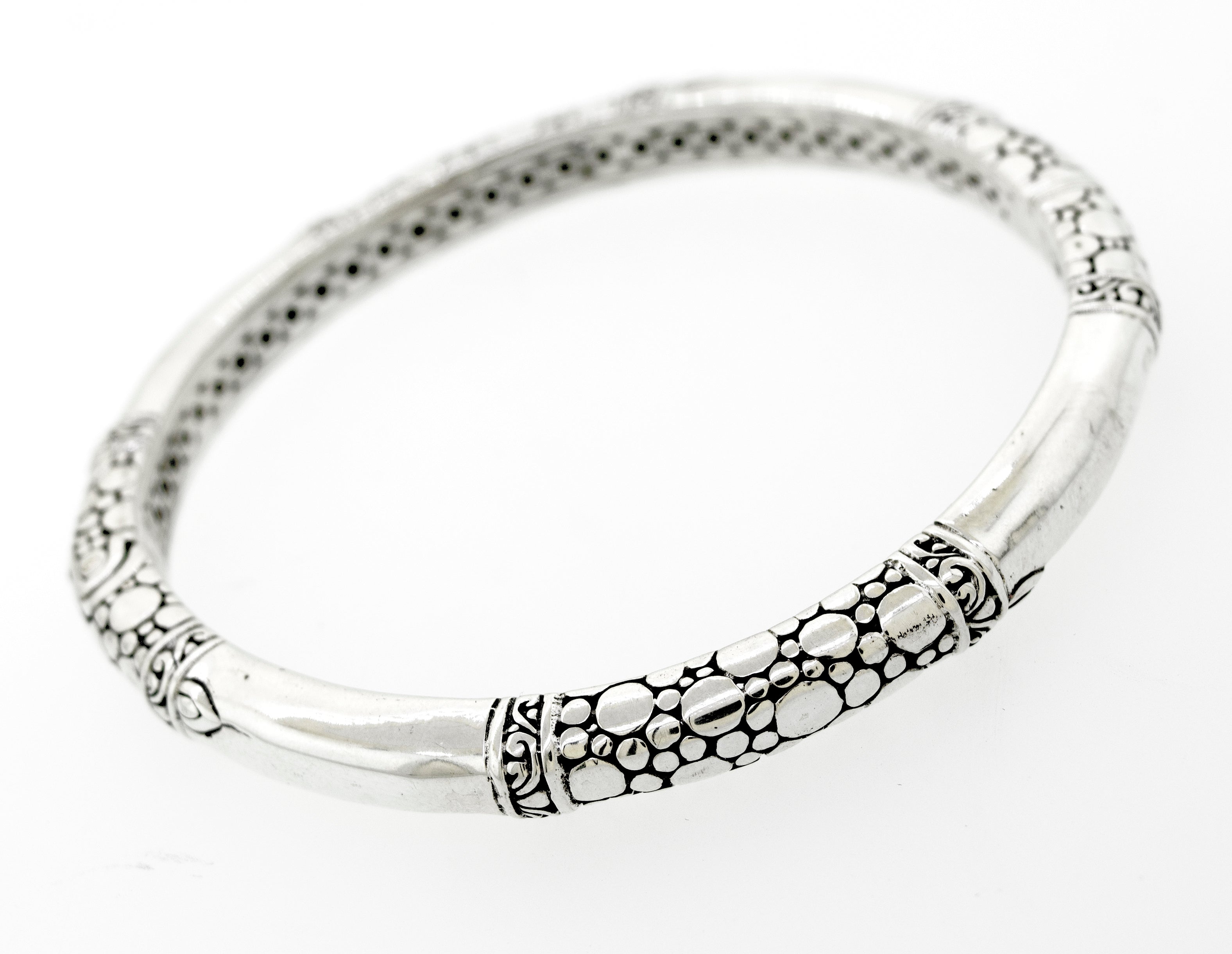 A Super Silver sterling silver handmade designer bangle with an ornate bubble design.