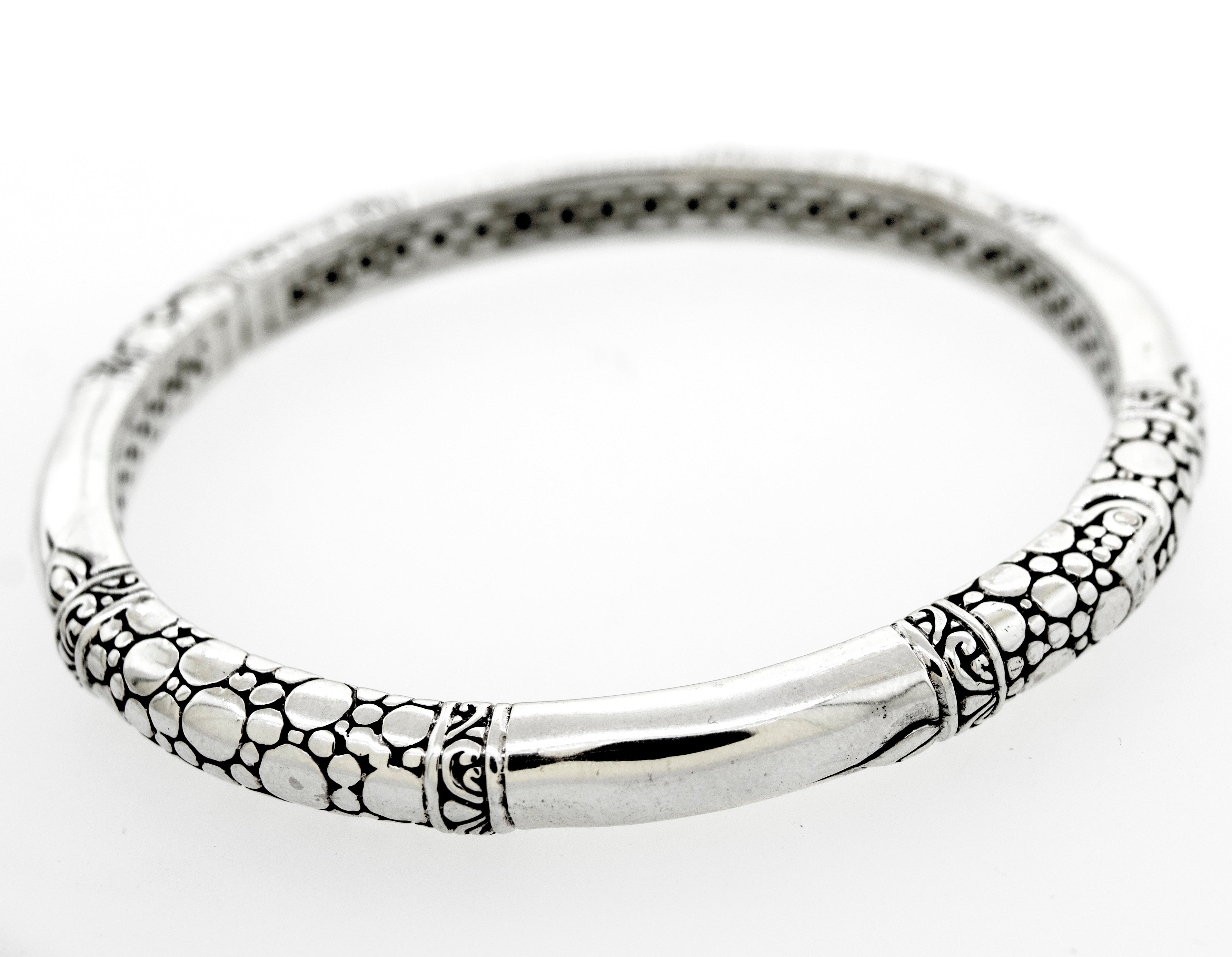 A Super Silver Sterling Silver Handmade Designer Bangle with a bubble design pattern on it.
