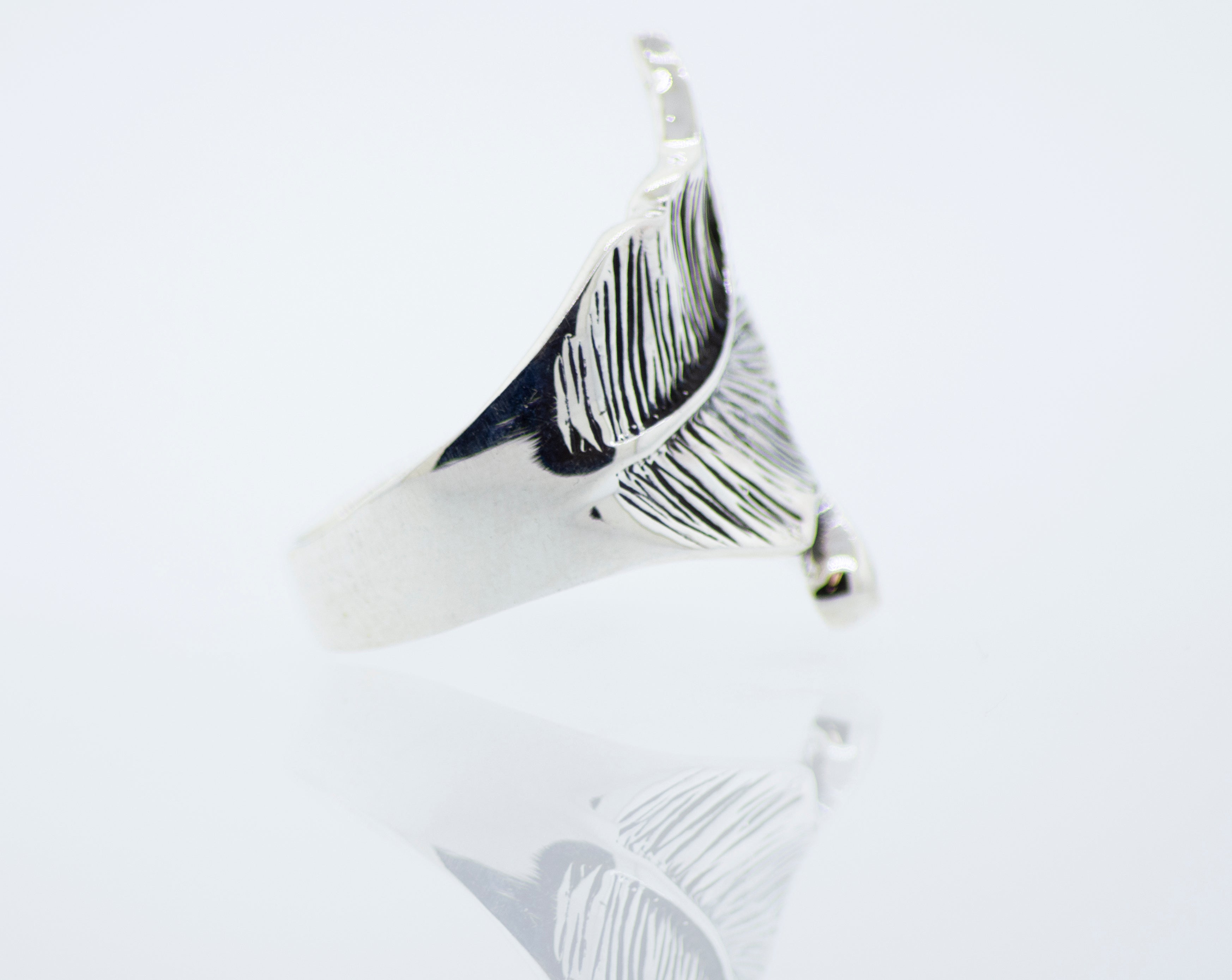 A Super Silver Etched Leaf Ring with a feather design.