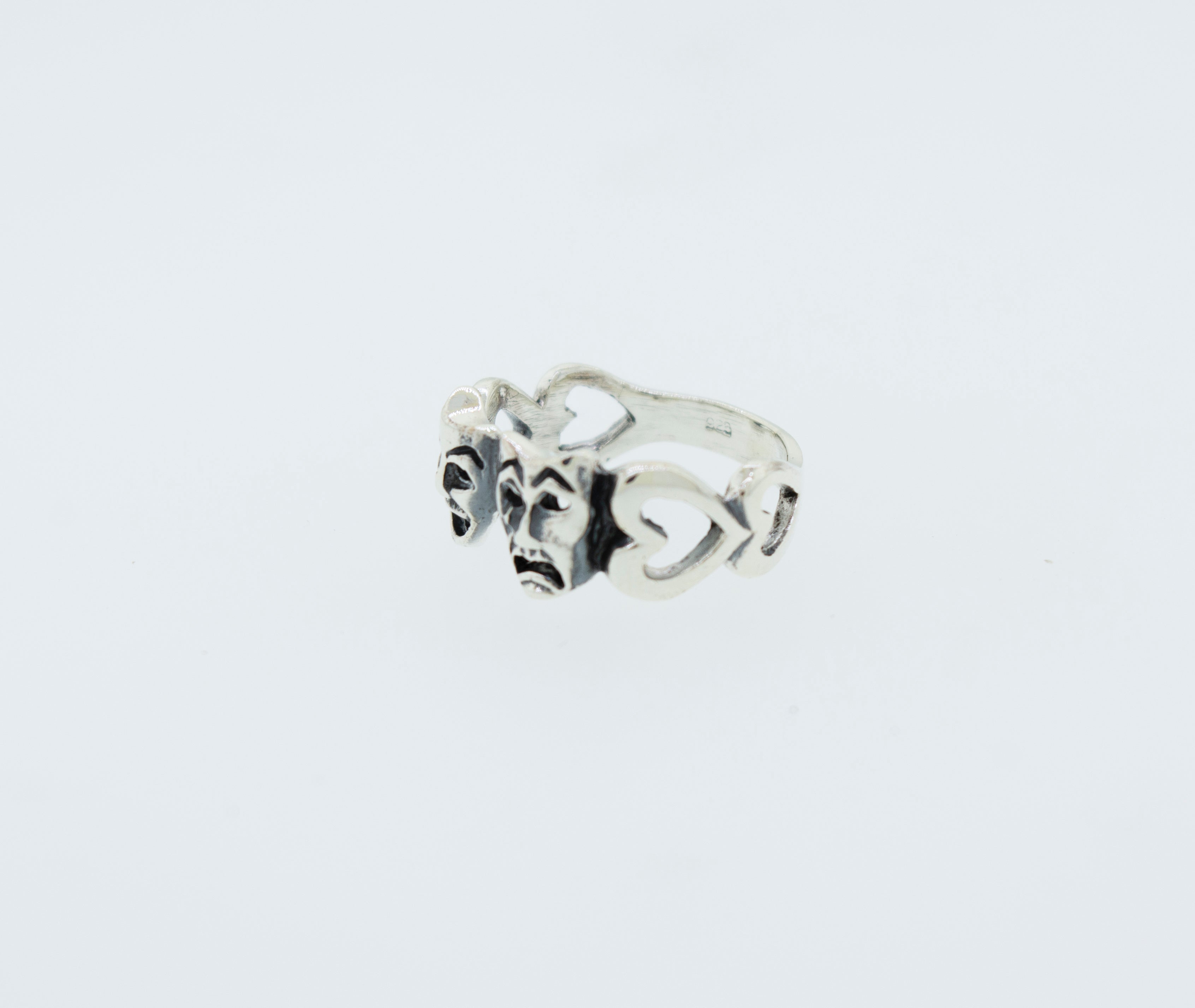 A classic Super Silver Comedy and Tragedy Ring with three hearts on it made of .925 silver.