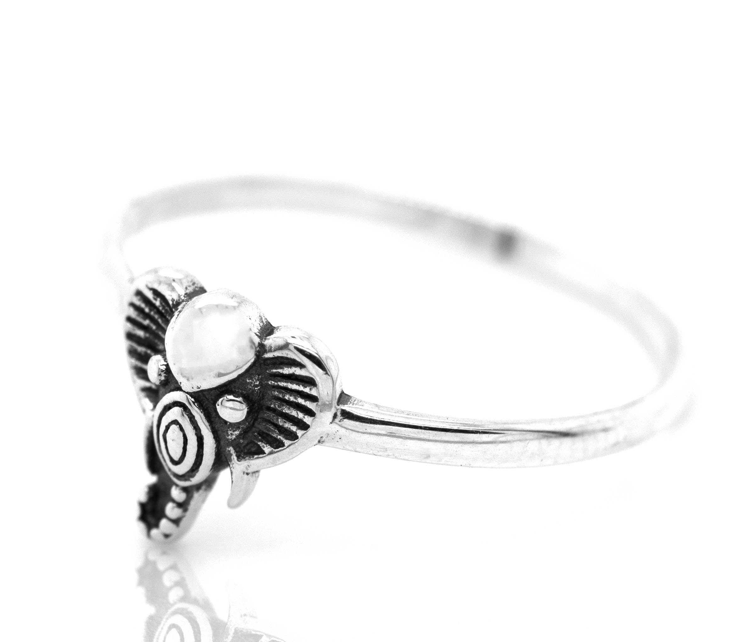 A Tribal Elephant Head Wire Ring from Super Silver, with a white stone, exuding an earthy vibe.