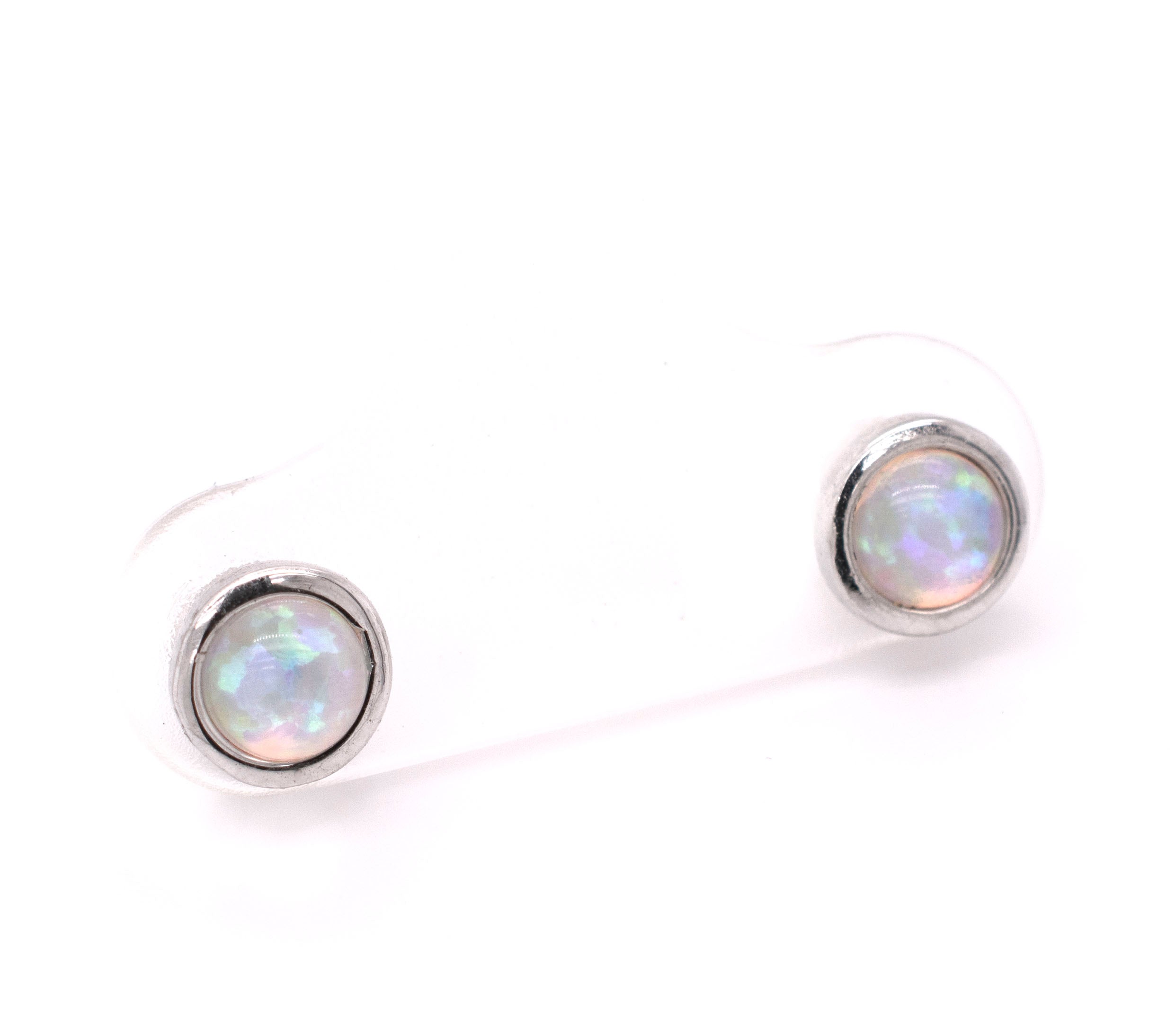 A pair of Radiant Australian Opal Studs from Super Silver showcasing brilliant colors on a white background.