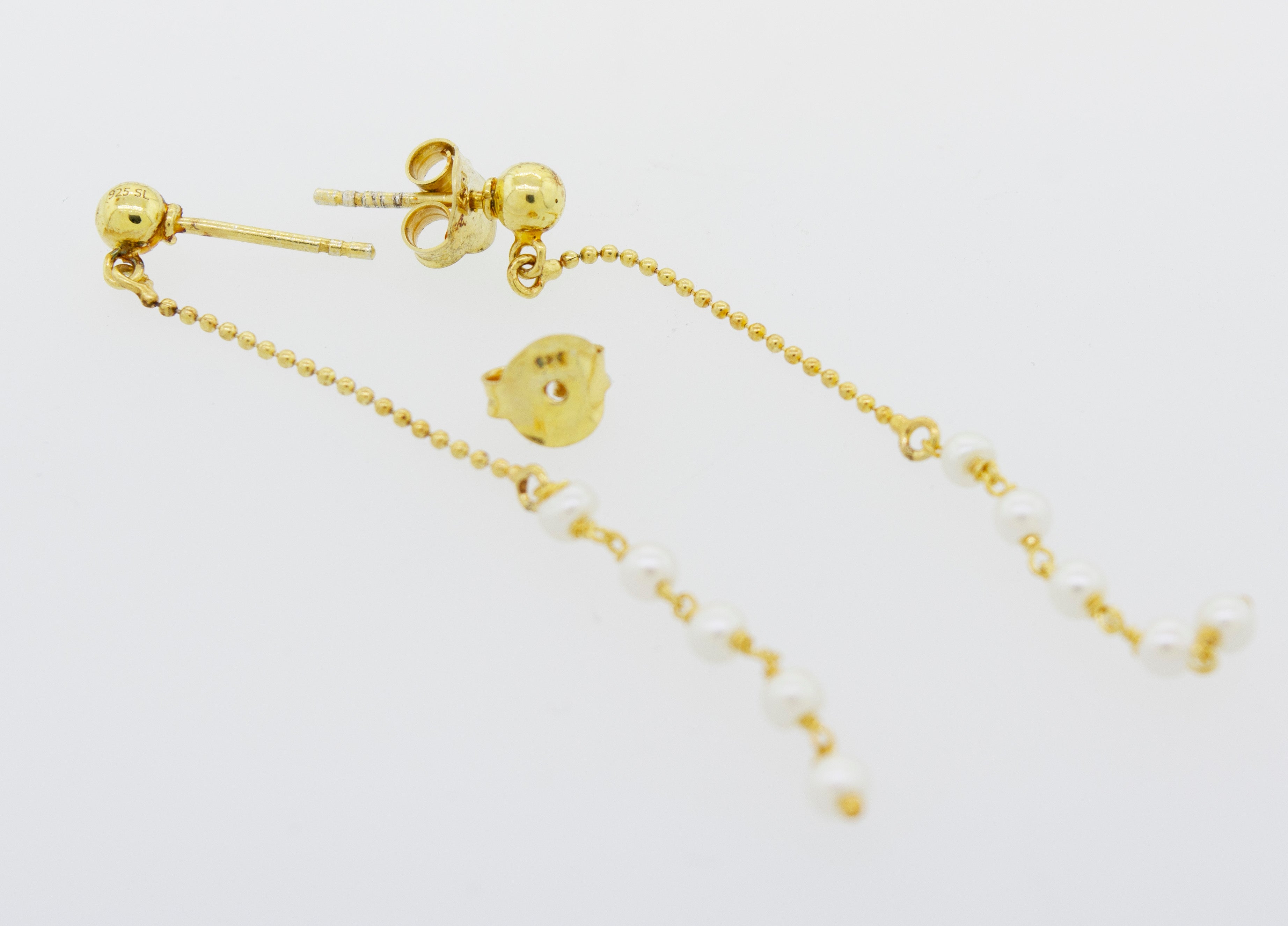 A pair of Super Silver Gold Plated Pearl Earrings with pearls plated in 22 Karat Gold.