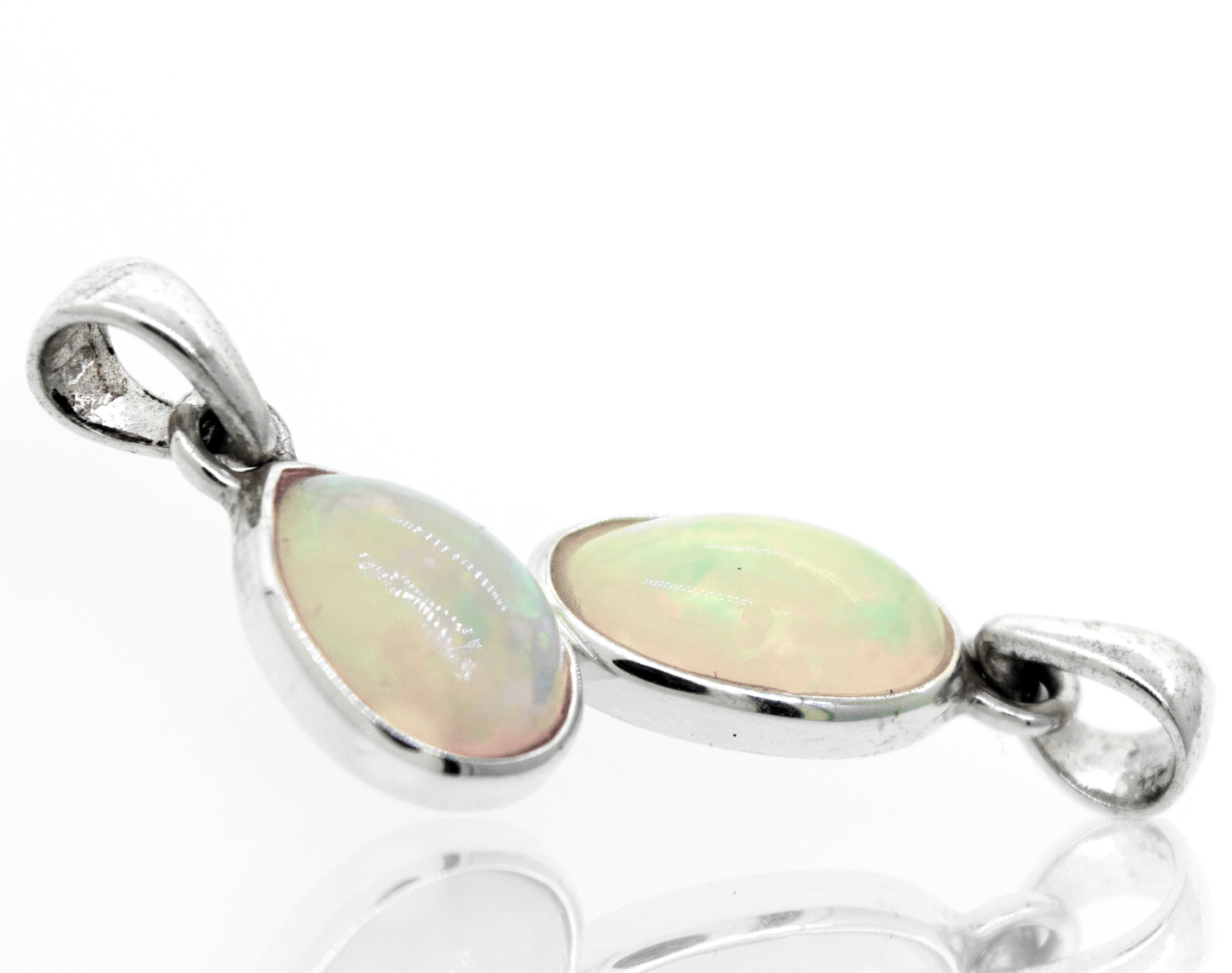 Two Magical Ethiopian Opal pendants from Super Silver on a white surface.