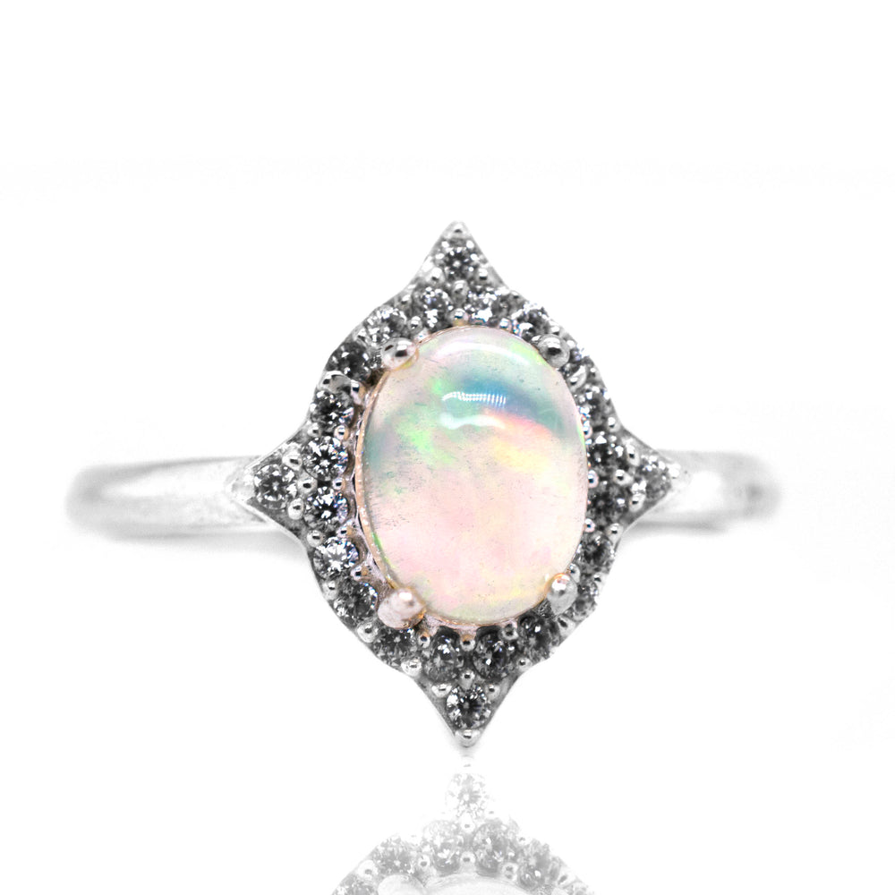 
                  
                    An elegant Elegant Ethiopian Opal Ring With Cubic Zirconia Stones on a white background.
                  
                