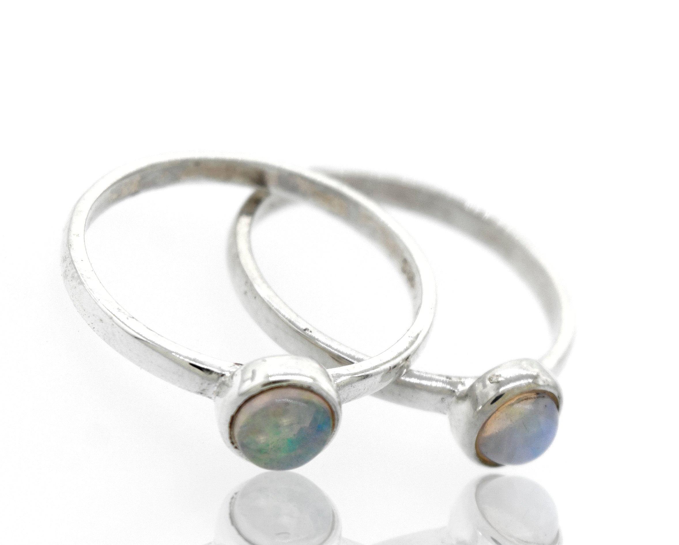 A stunning pair of statement silver rings adorned with captivating Glowing Ethiopian Opal stones.