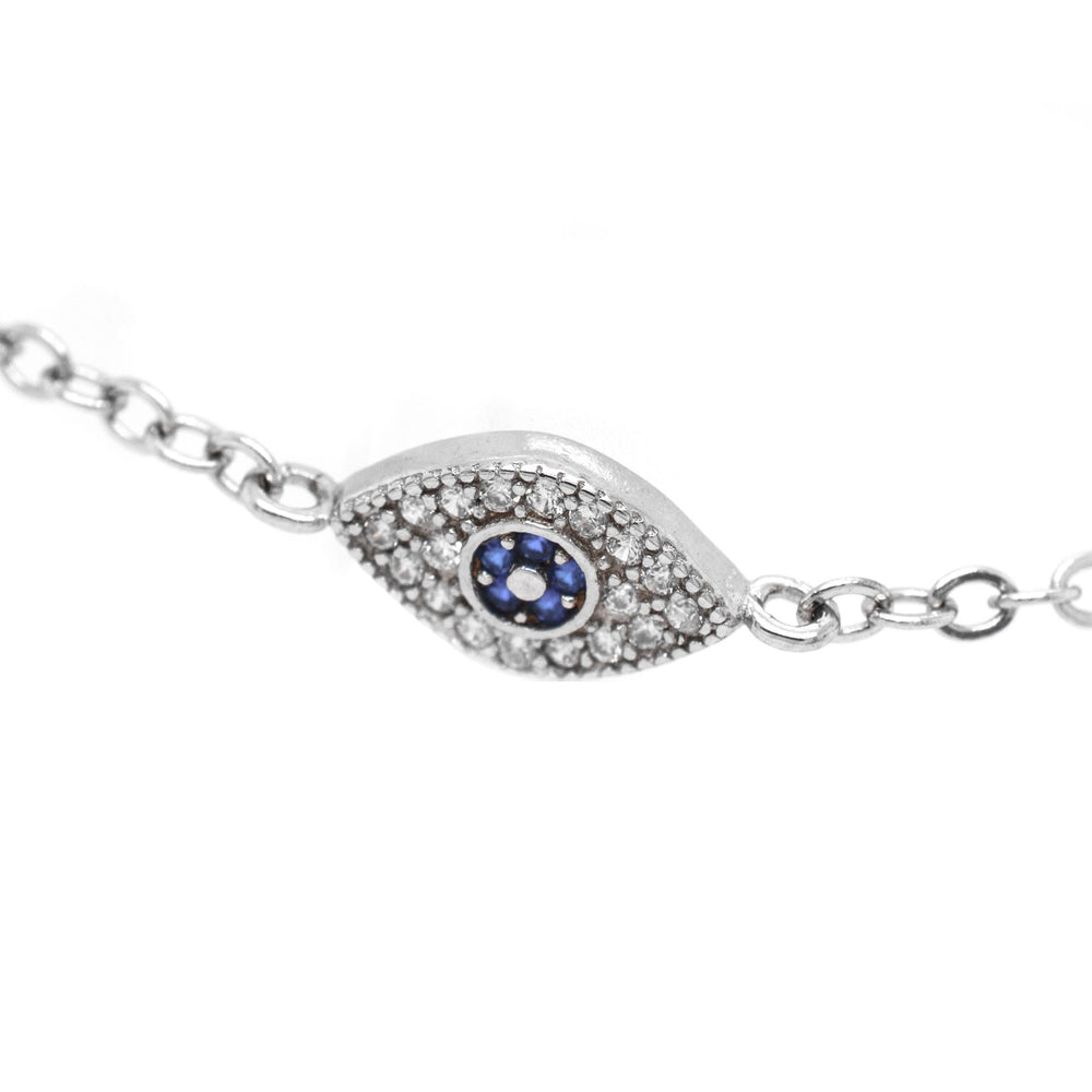
                  
                    A stunning Classic Blue Pave Cubic Zirconia Evil Eye Bracelet adorned with blue sapphires and diamonds, crafted in sterling silver by Super Silver for an exquisite touch of elegance.
                  
                